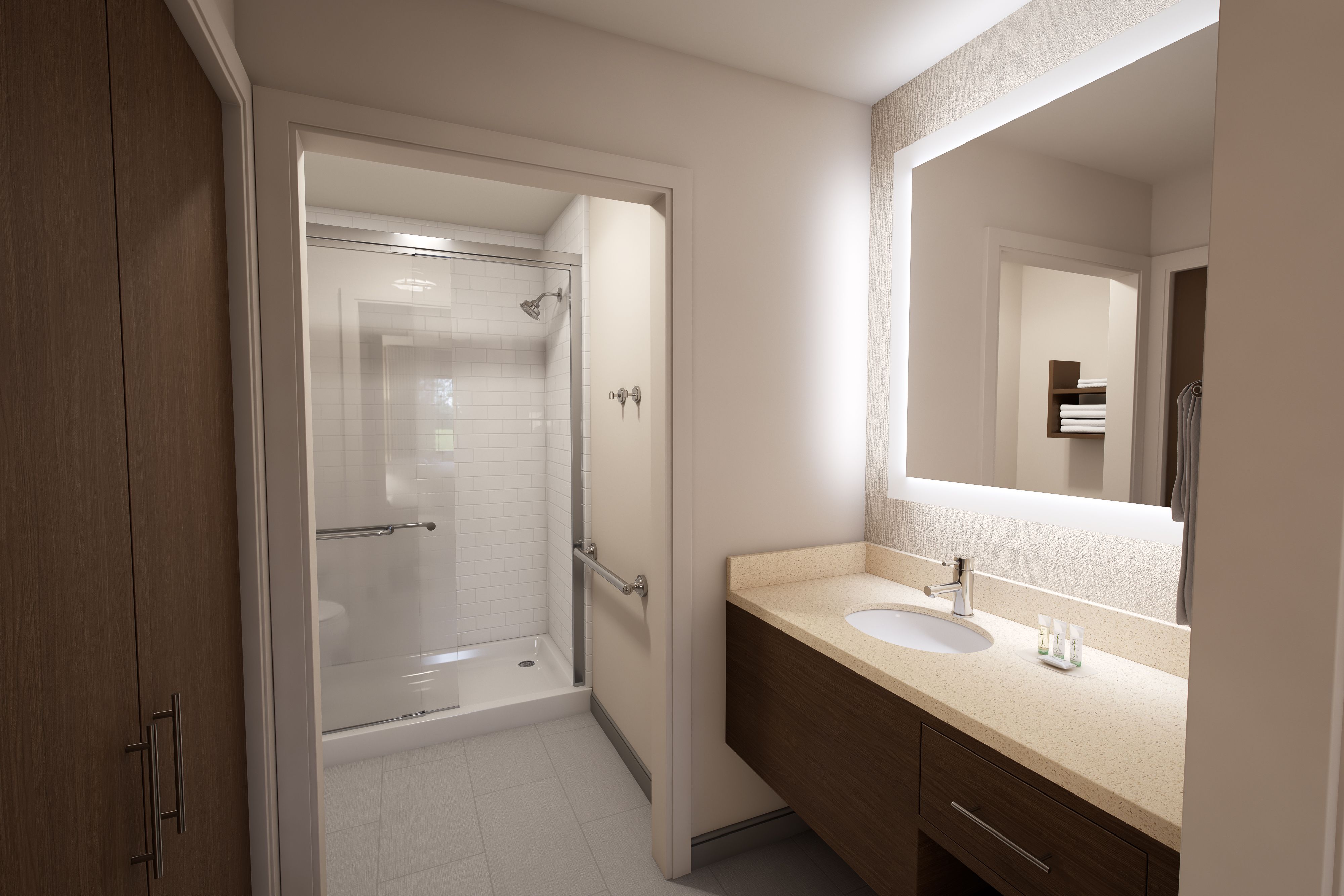 image Enjoy a modern bathroom with sleek fixtures, a spacious shower, and ample storage for your essentials.