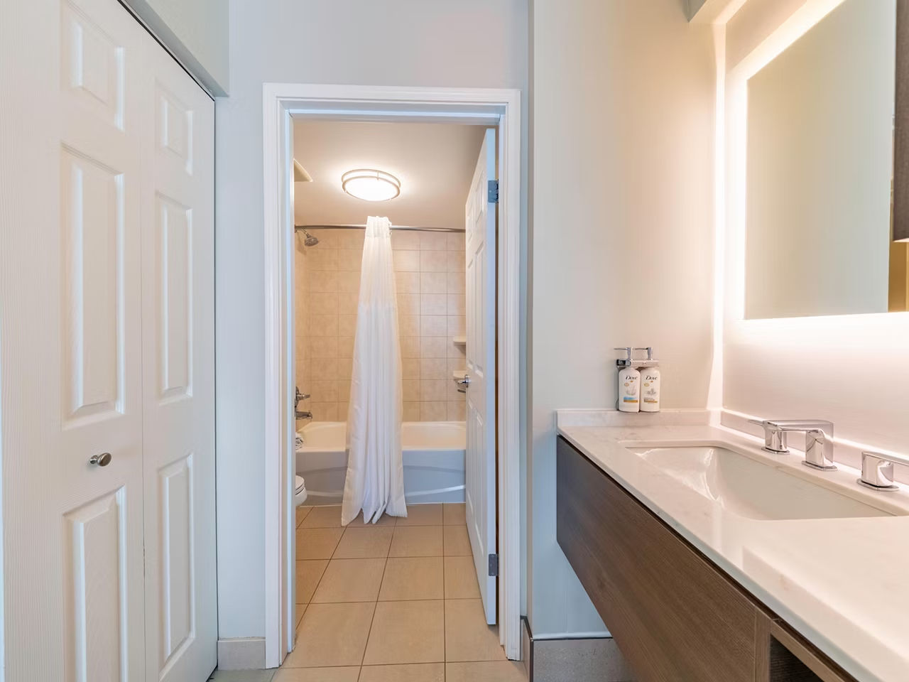 image Step into the bathroom, featuring polished fixtures and soft lighting for your daily routine.