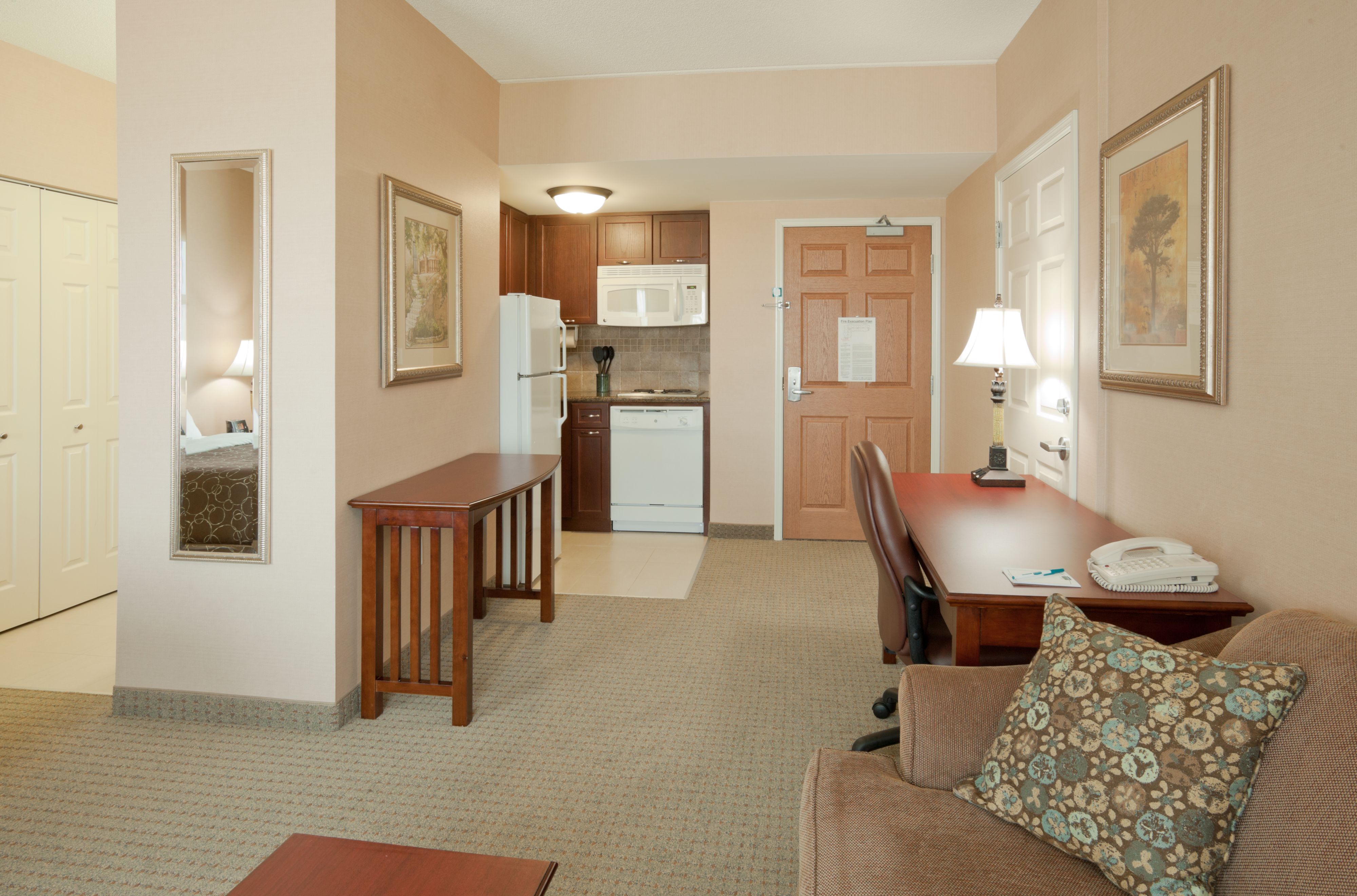 image Kitchen with essential appliances and a small dining area.