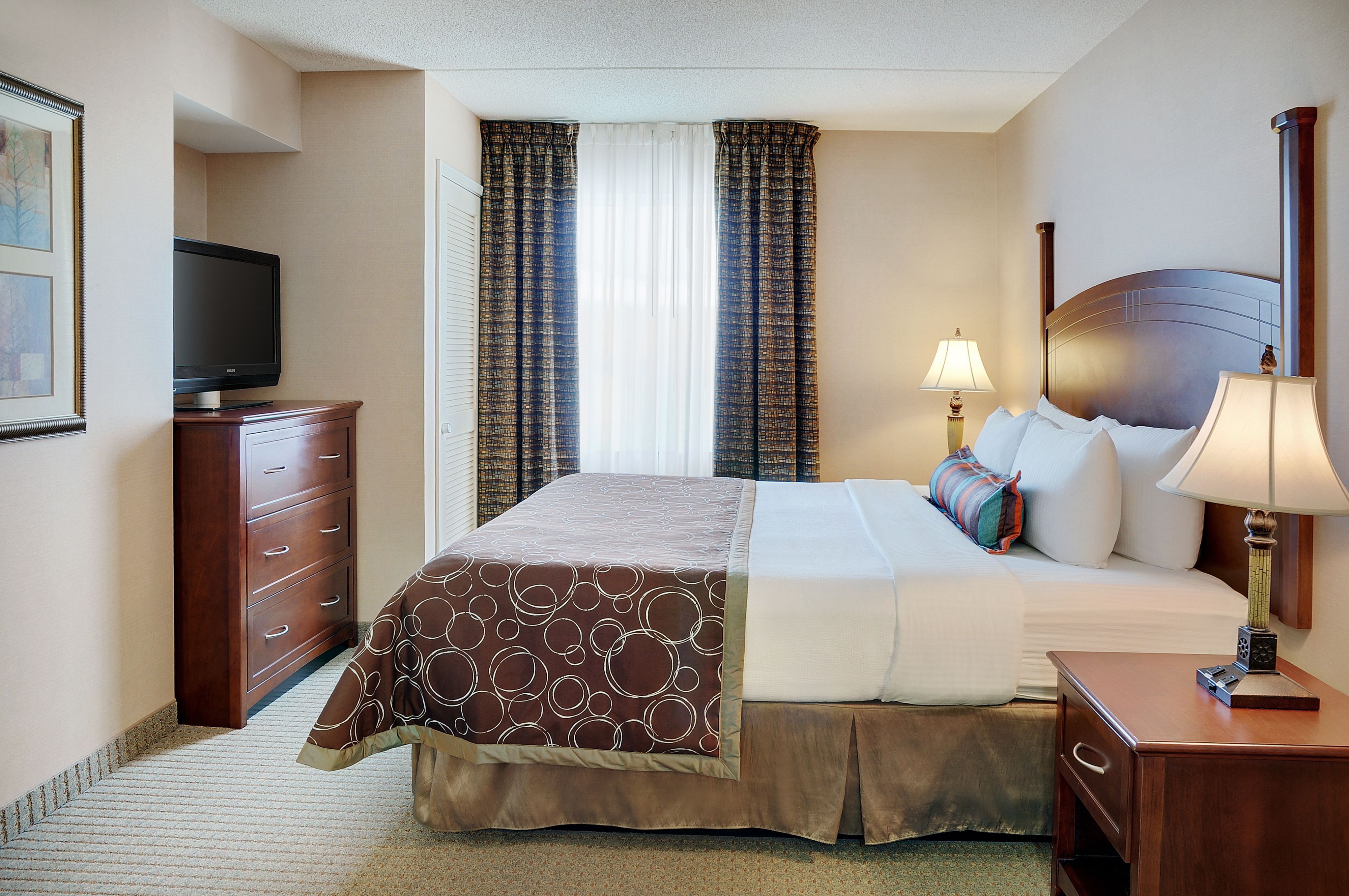 image King bedroom with soft lighting and premium bedding.