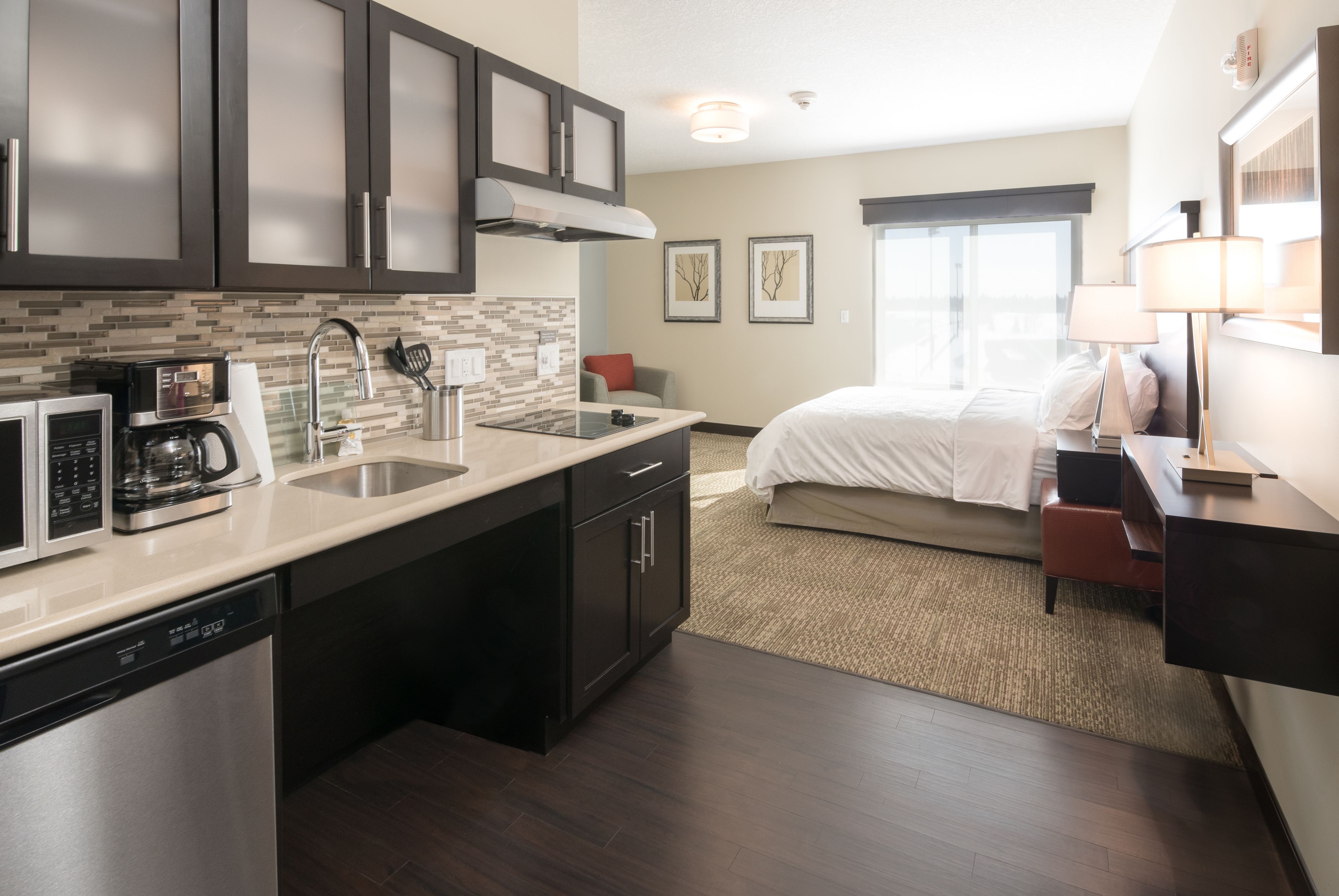 image Open studio layout with kitchen area and comfortable sleeping space.