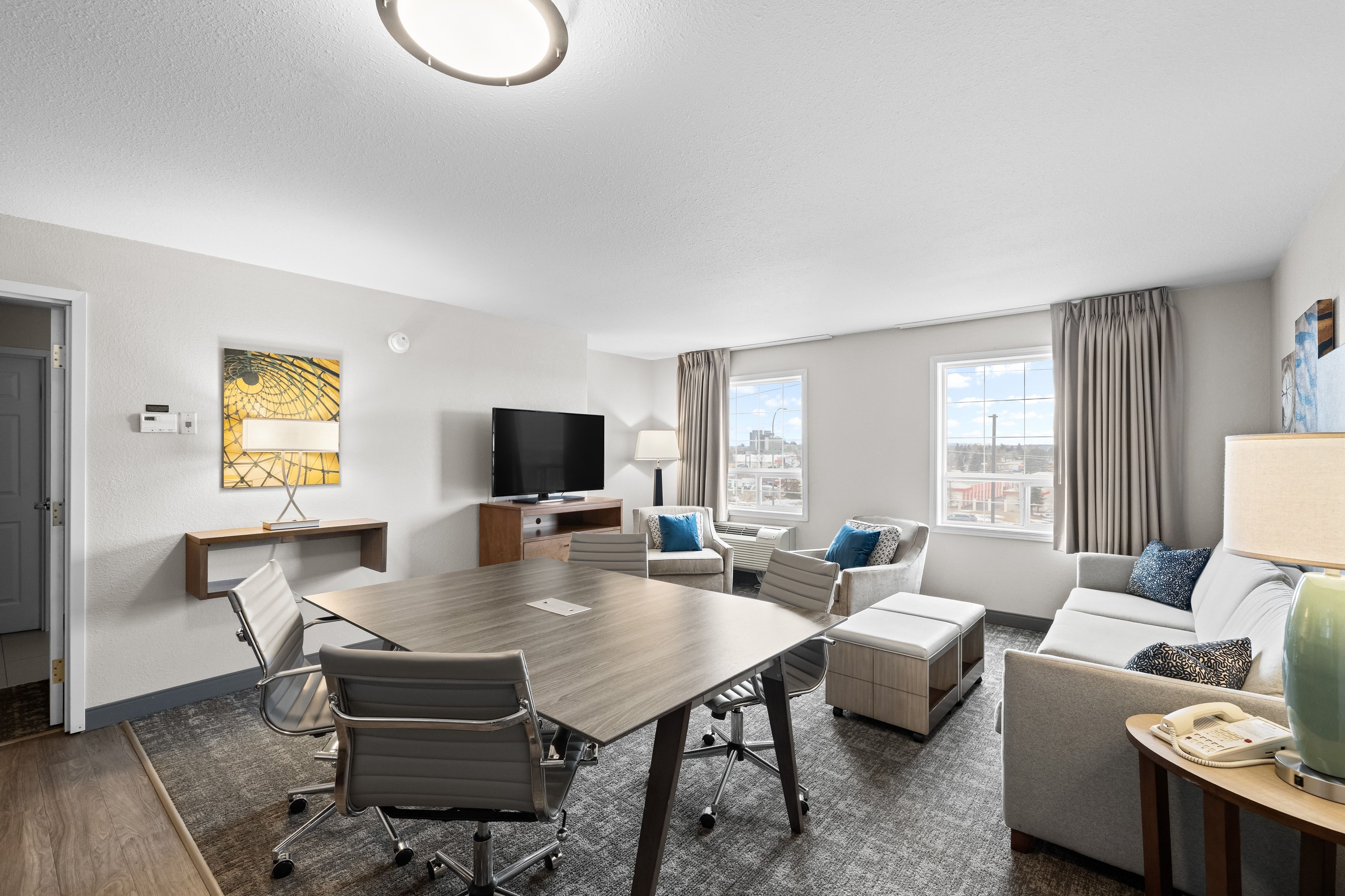 image Spacious living area with modern furnishings and natural light.