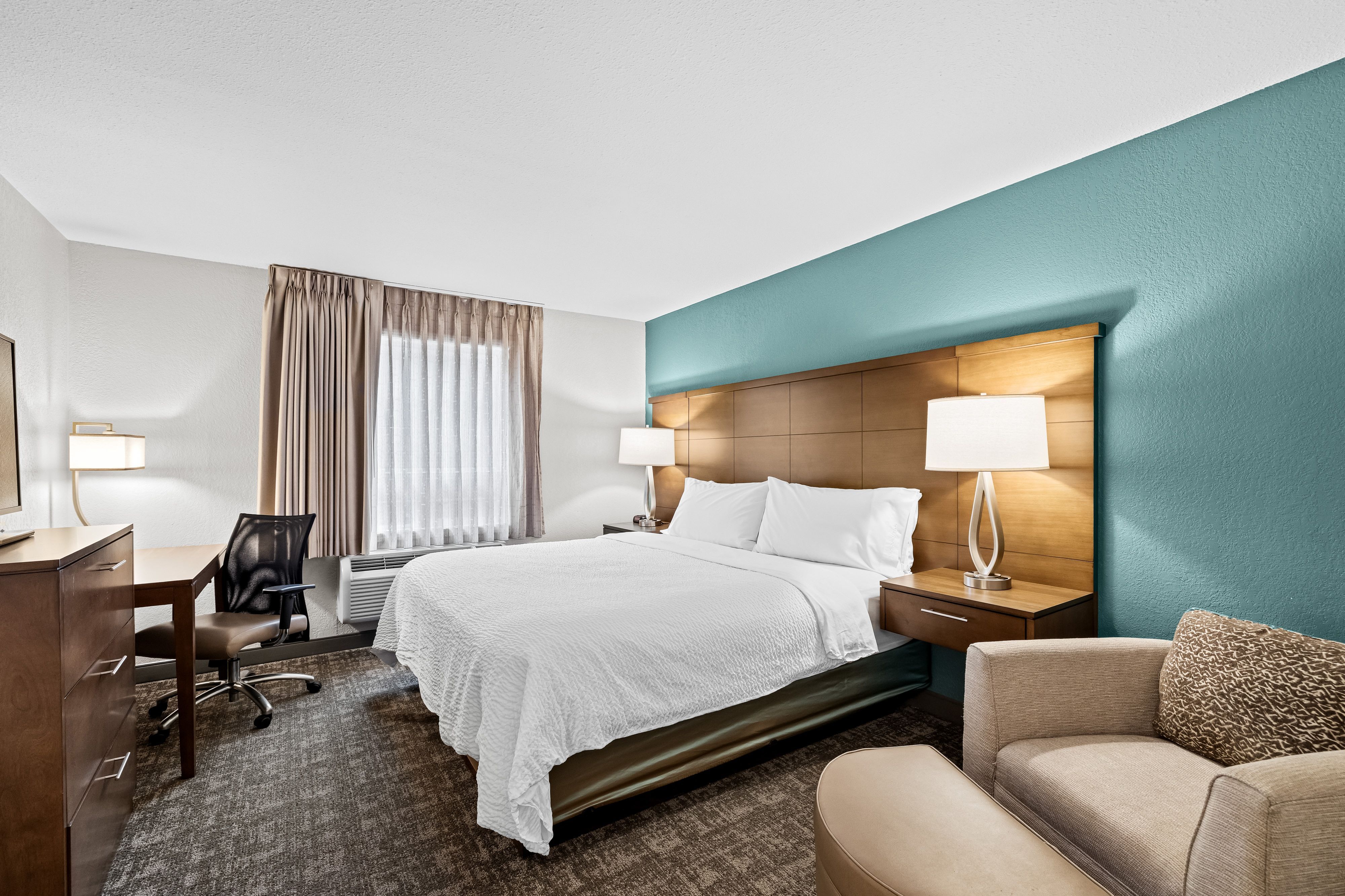 image Comfortable bedroom with wardrobe and soft lighting for a good night’s rest.