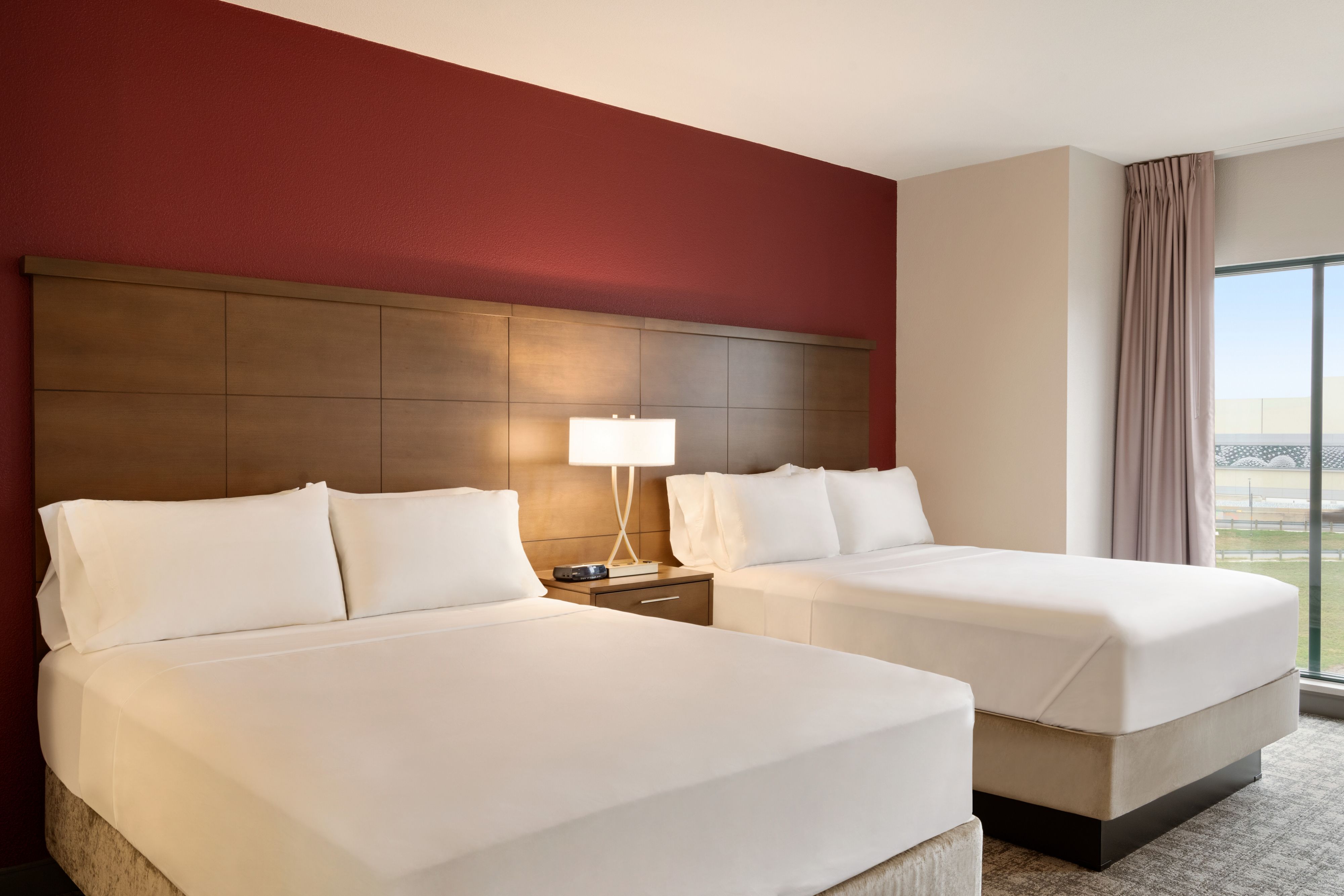 image Cozy sleeping area with two comfortable beds and modern décor.