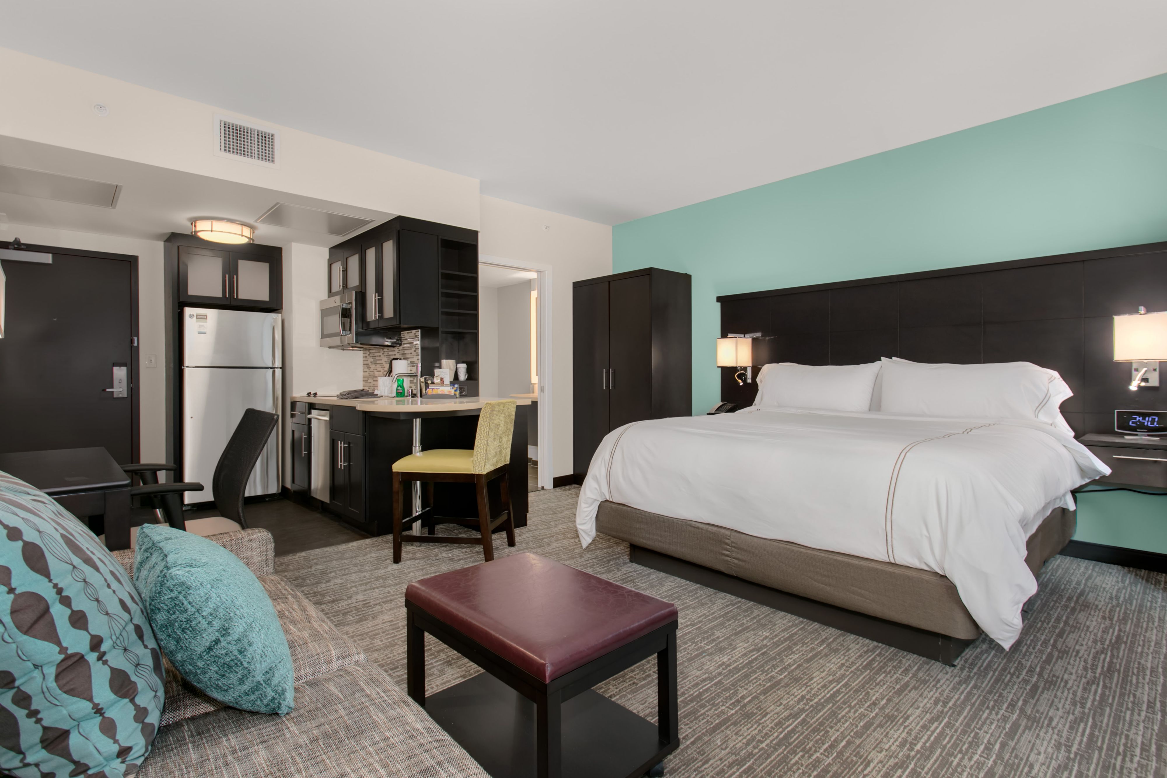image Studio suite with king bed, kitchen, and seating area.