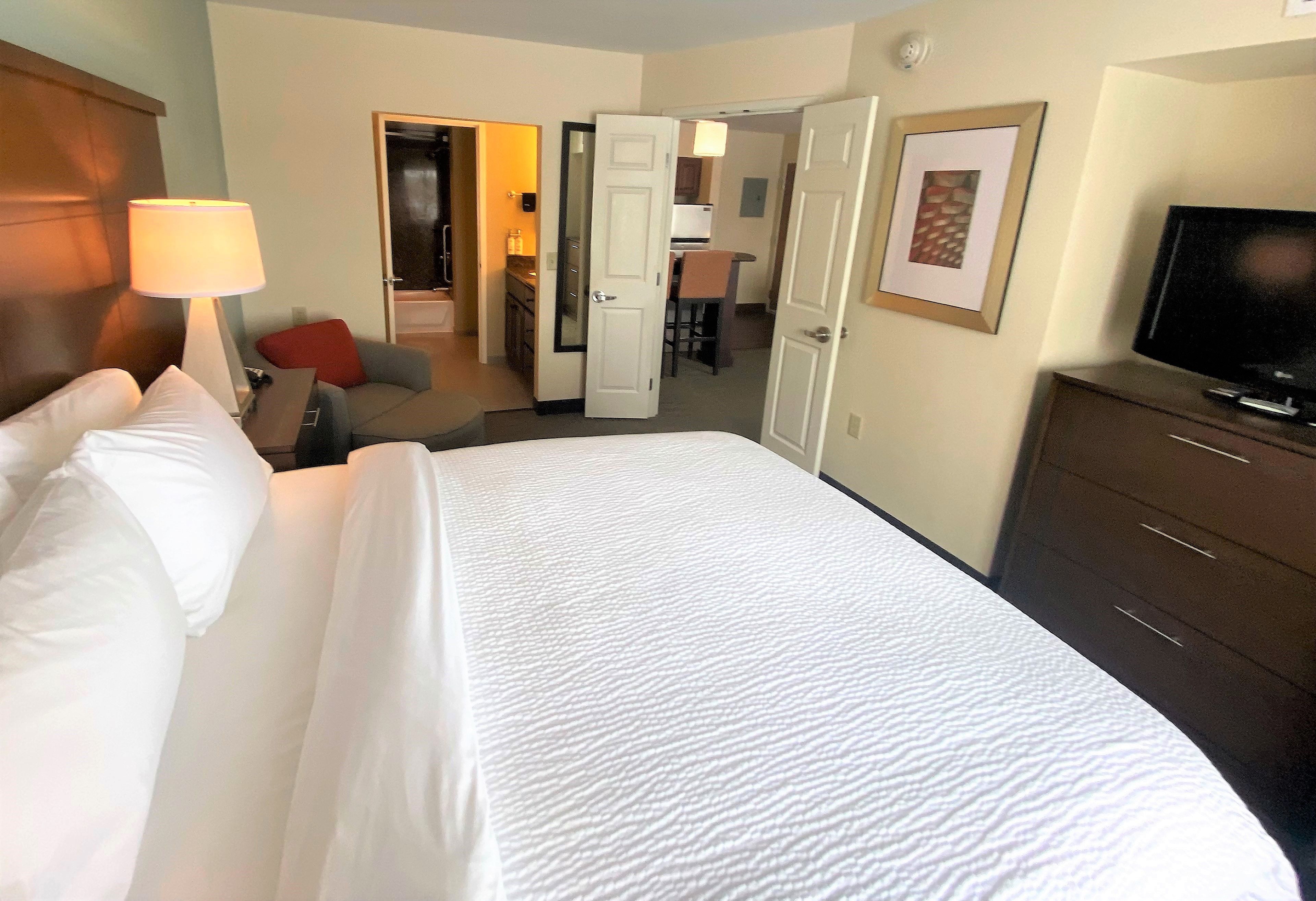 image Cuddle up in comfort with a warm, inviting bed and a perfect spot to relax after a long day.