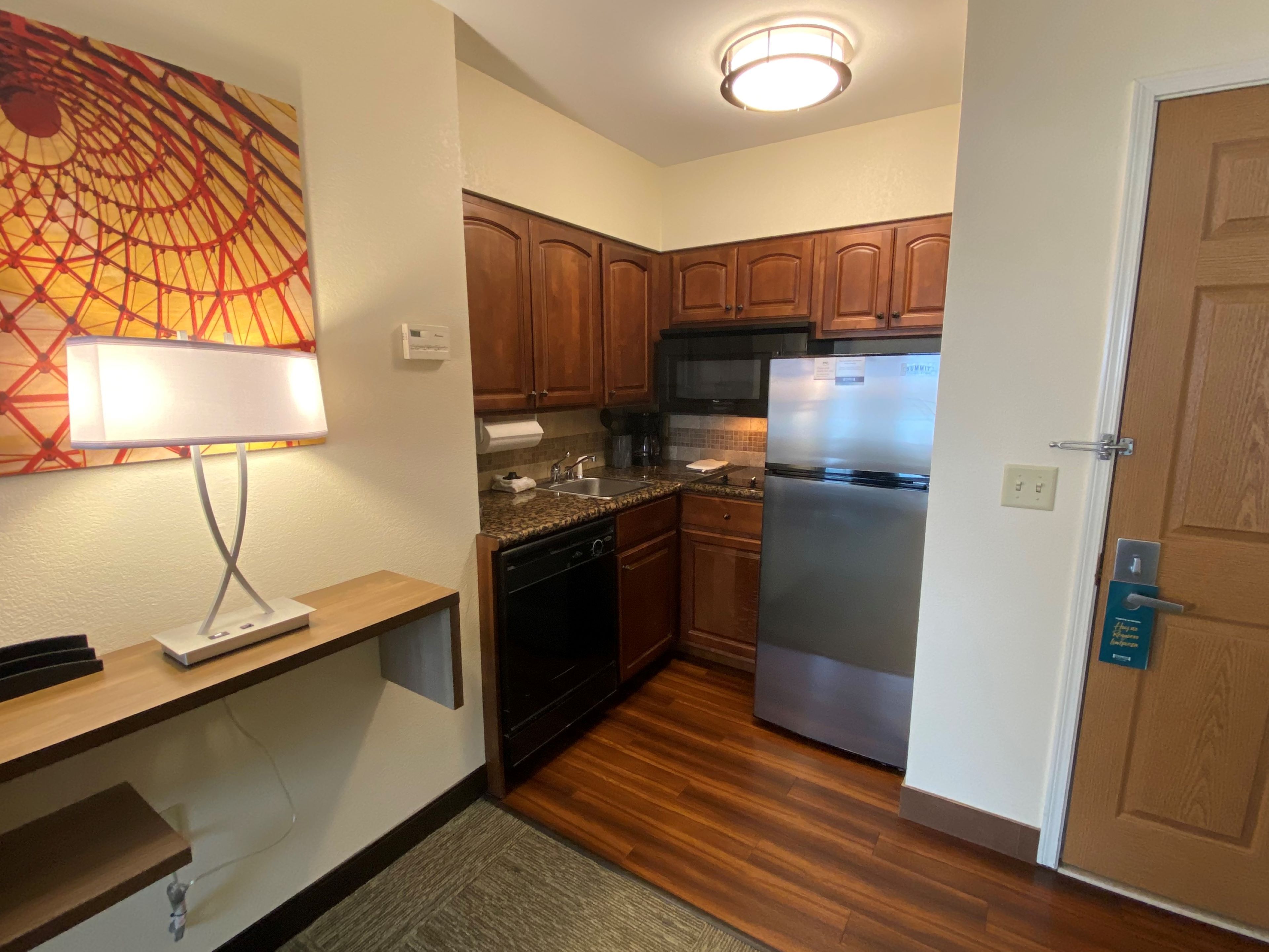 image Cook and dine with ease in your modern kitchen, perfect for a quick breakfast or dinner.