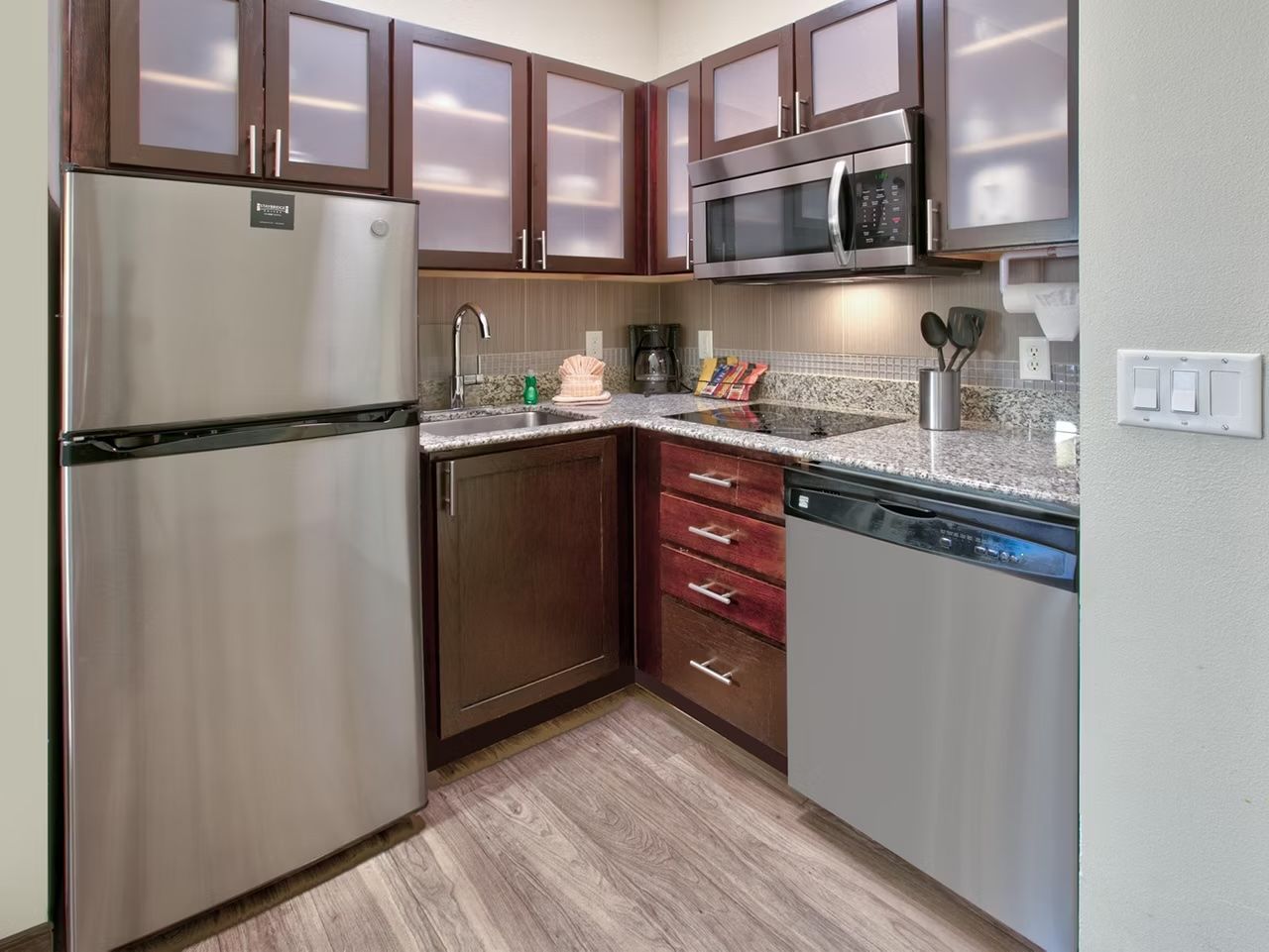 image Kitchen with stainless steel appliances and counter space for cooking in