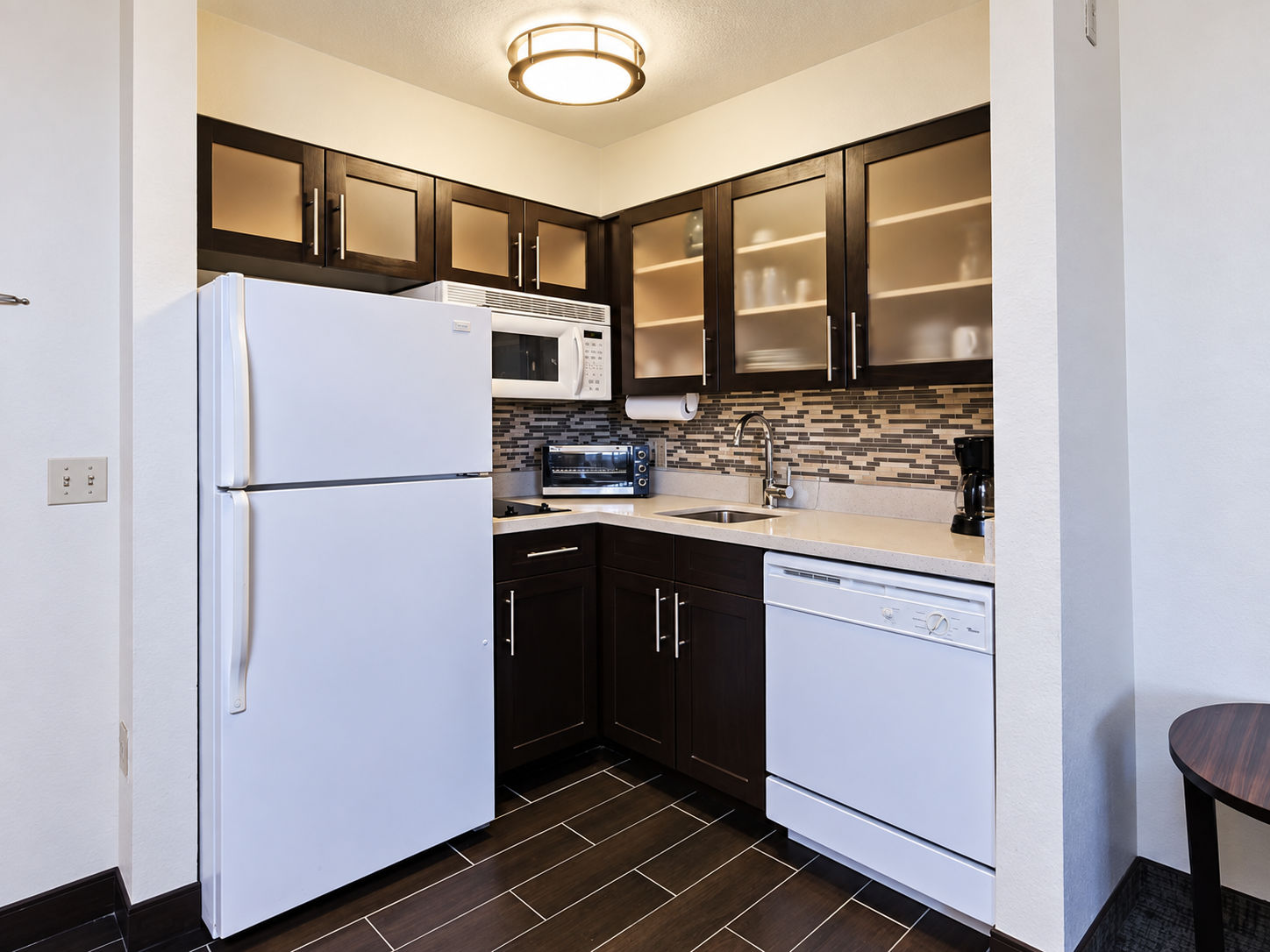 image Cozy kitchen with modern appliances and stylish cabinetry.