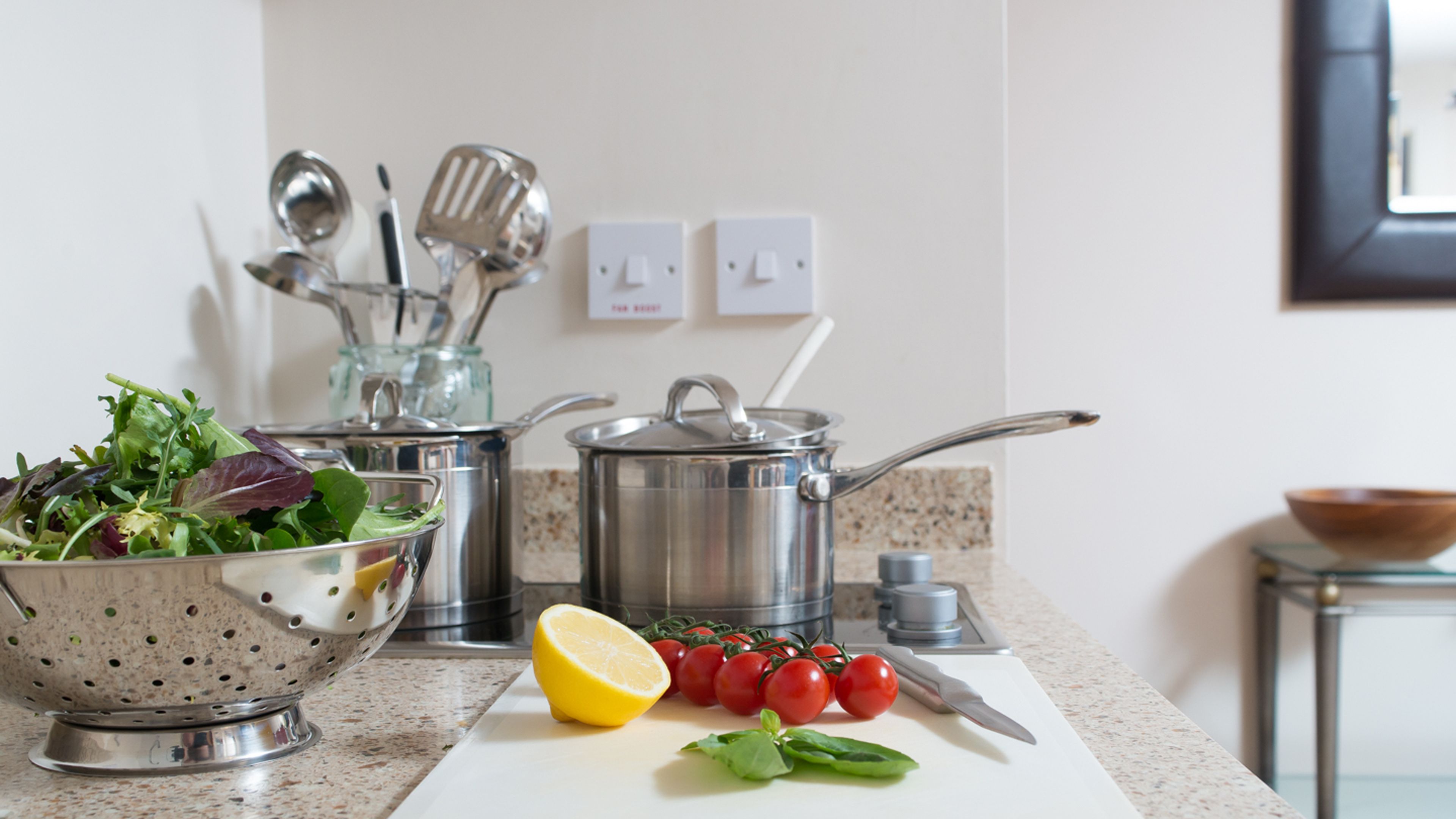 image Kitchenette with cooking utensils and preparation counter.