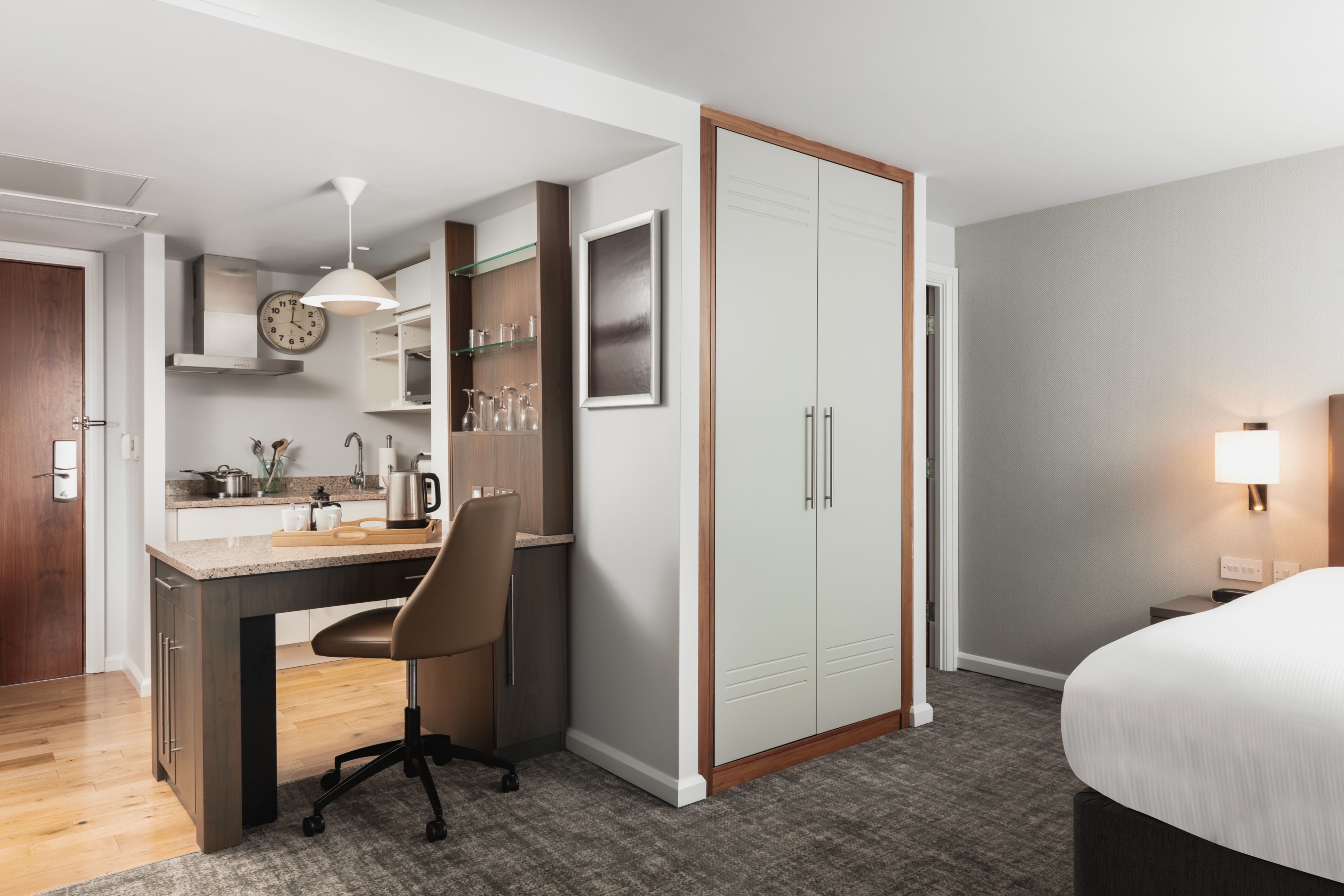 image Compact kitchenette with modern furnishings.