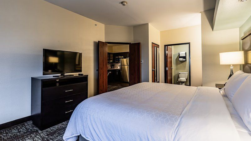 image Drift to sleep in this plush bed in a private bedroom.