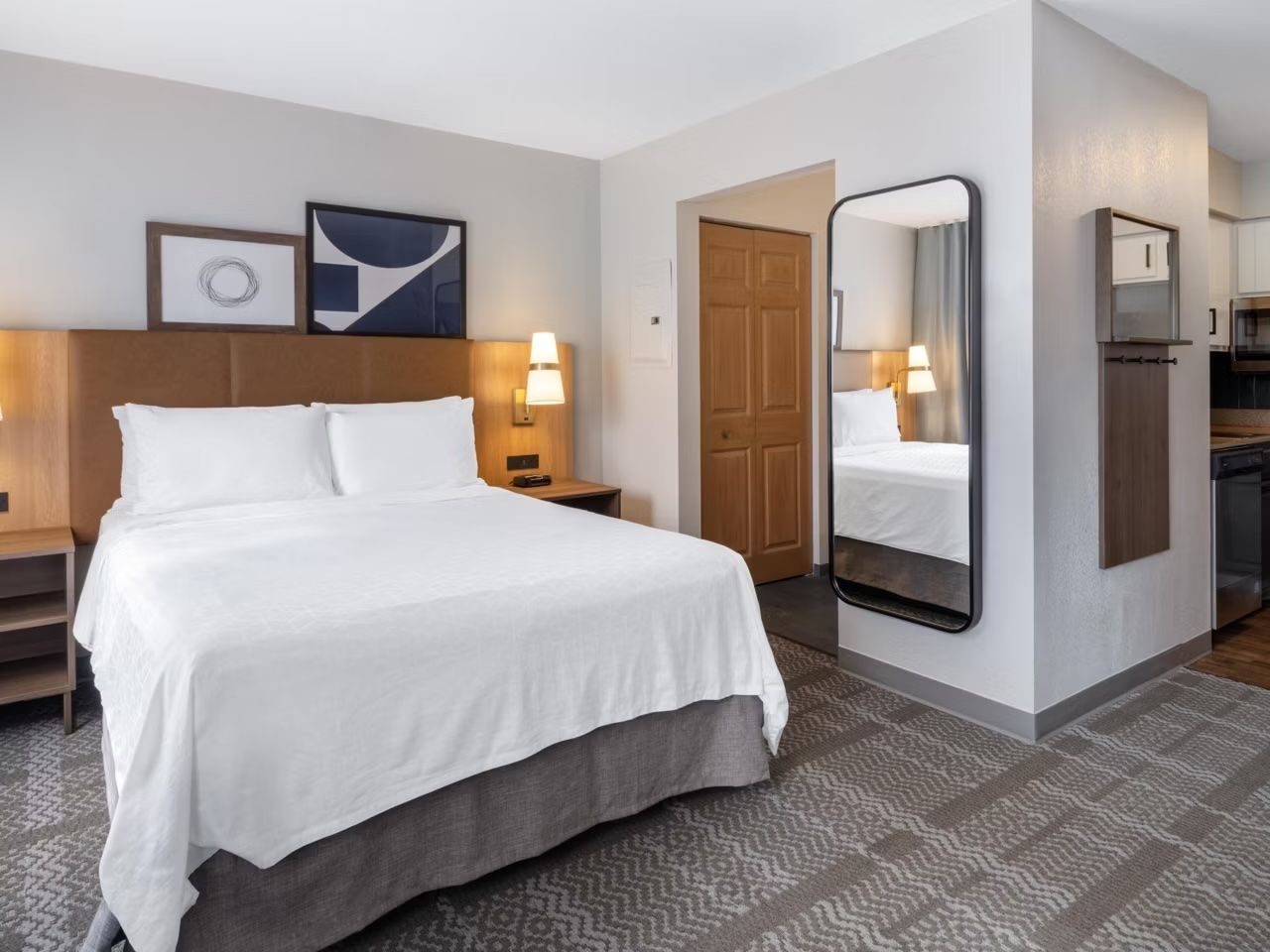 image Studio with queen bed and modern decor.