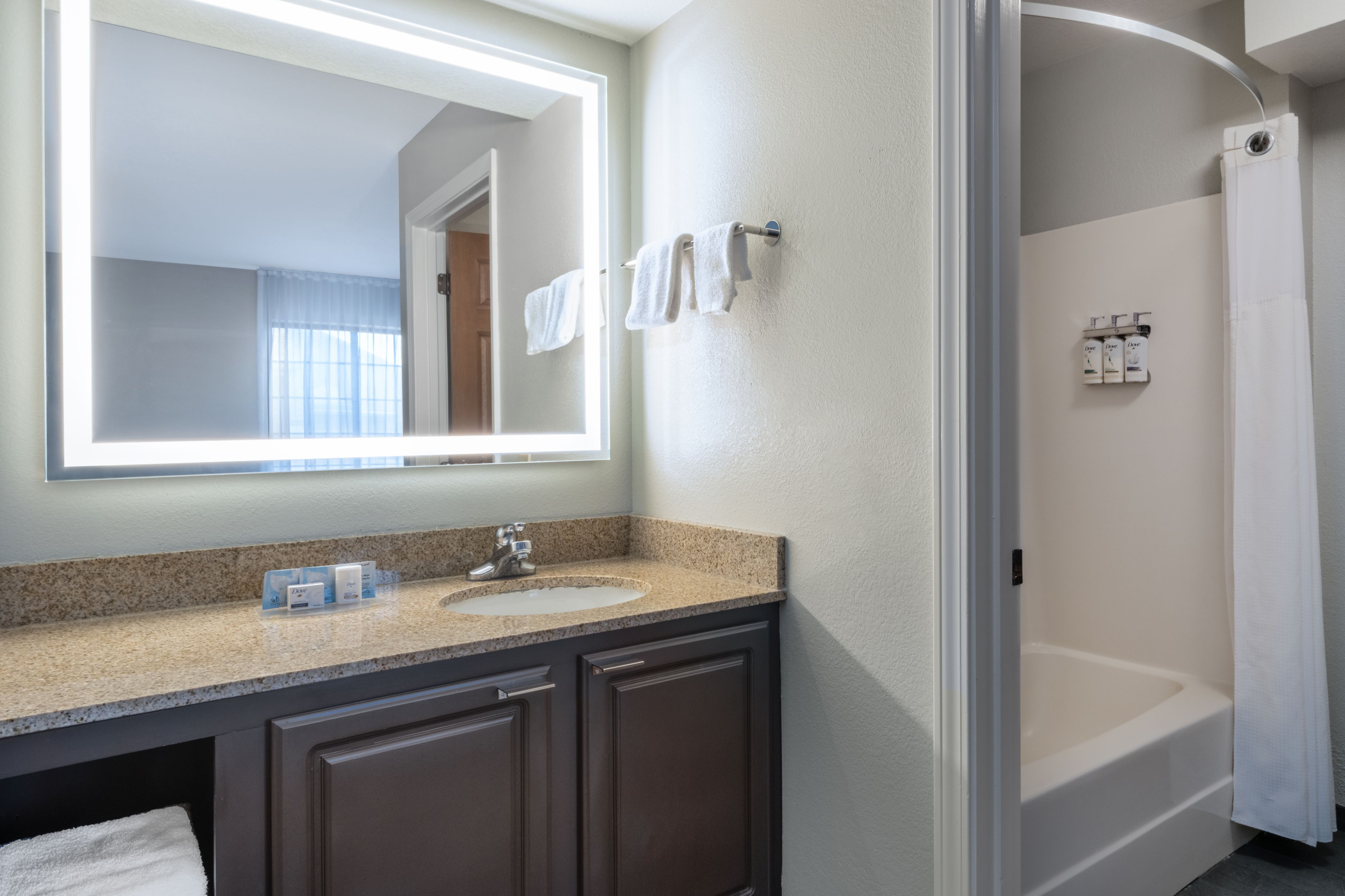 image Bathroom with vanity, mirror, and shower.