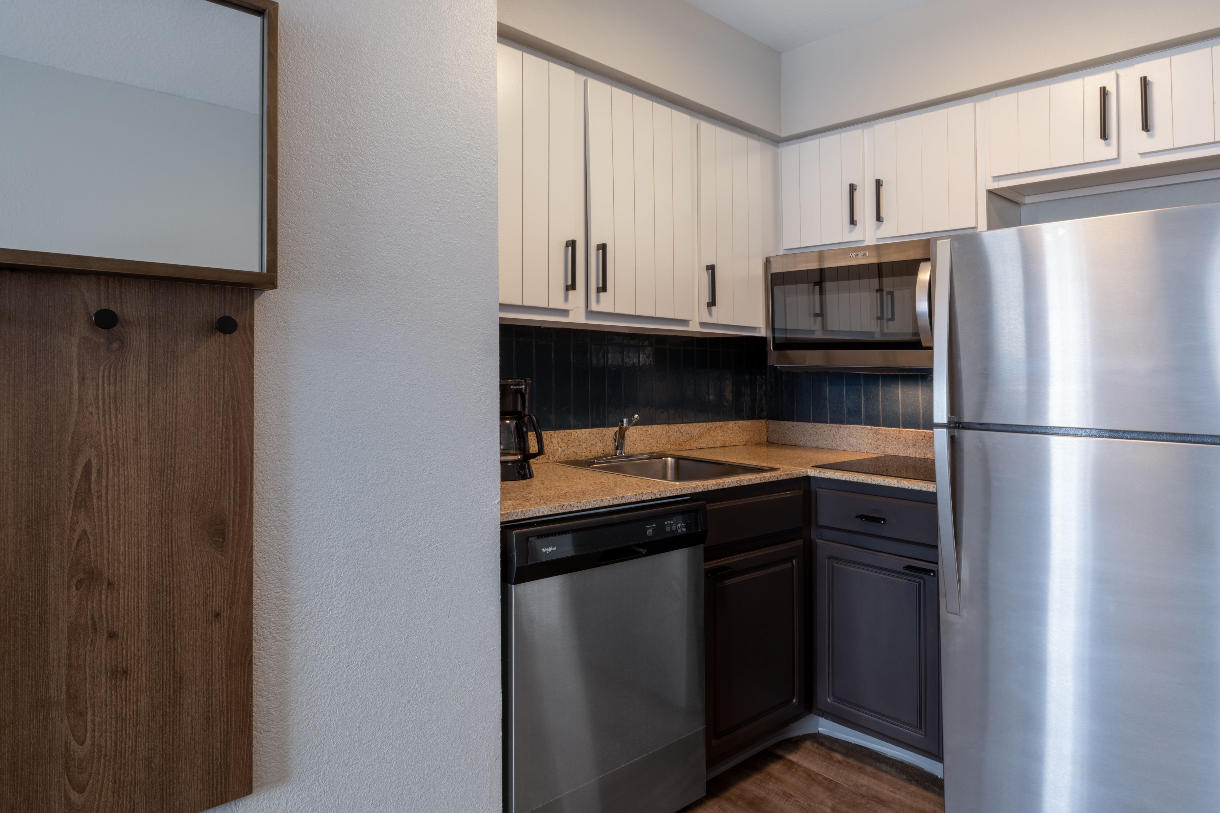 image Kitchen with stainless appliances and cabinetry.