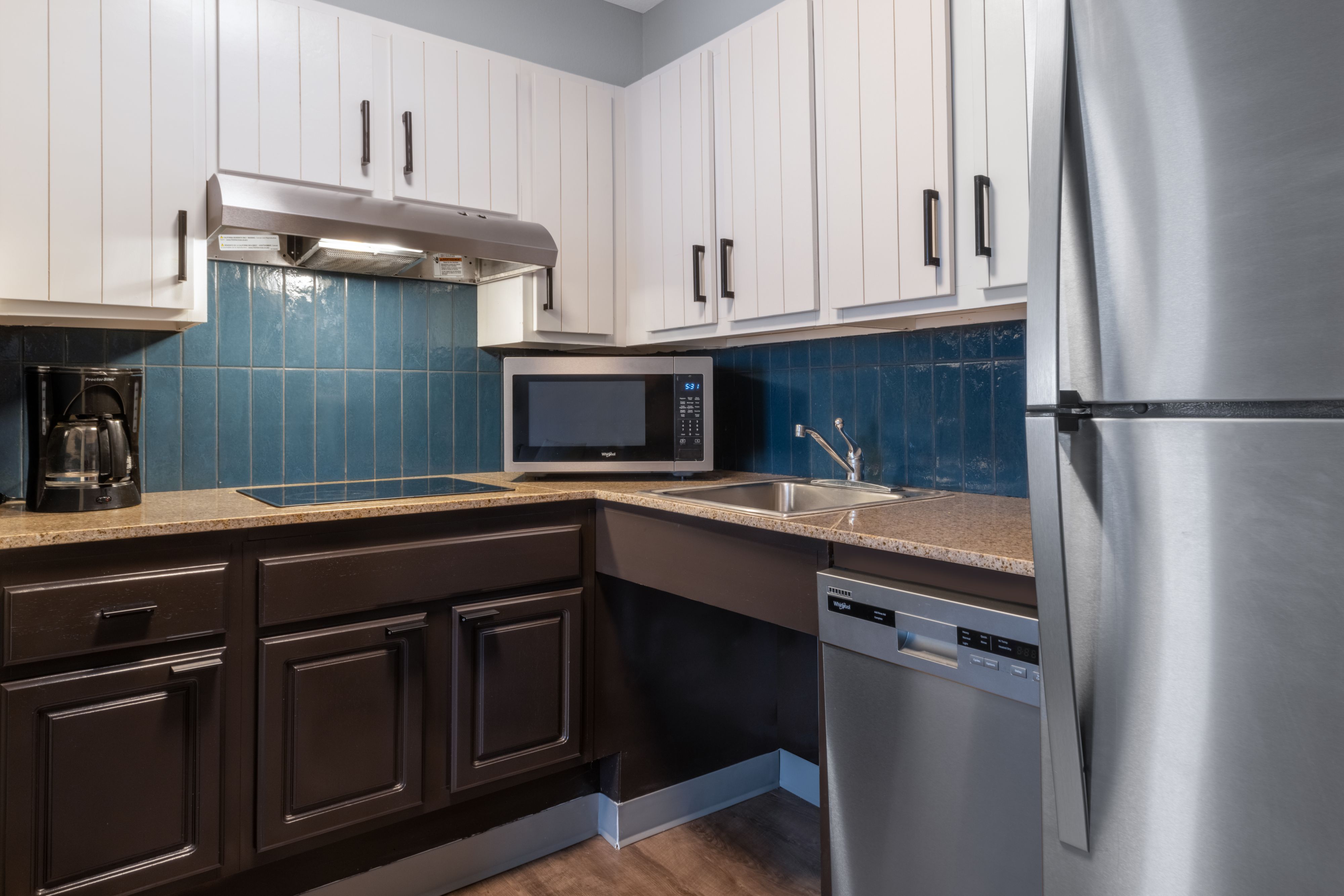 image Fully equipped kitchen with full-size appliances and countertop.