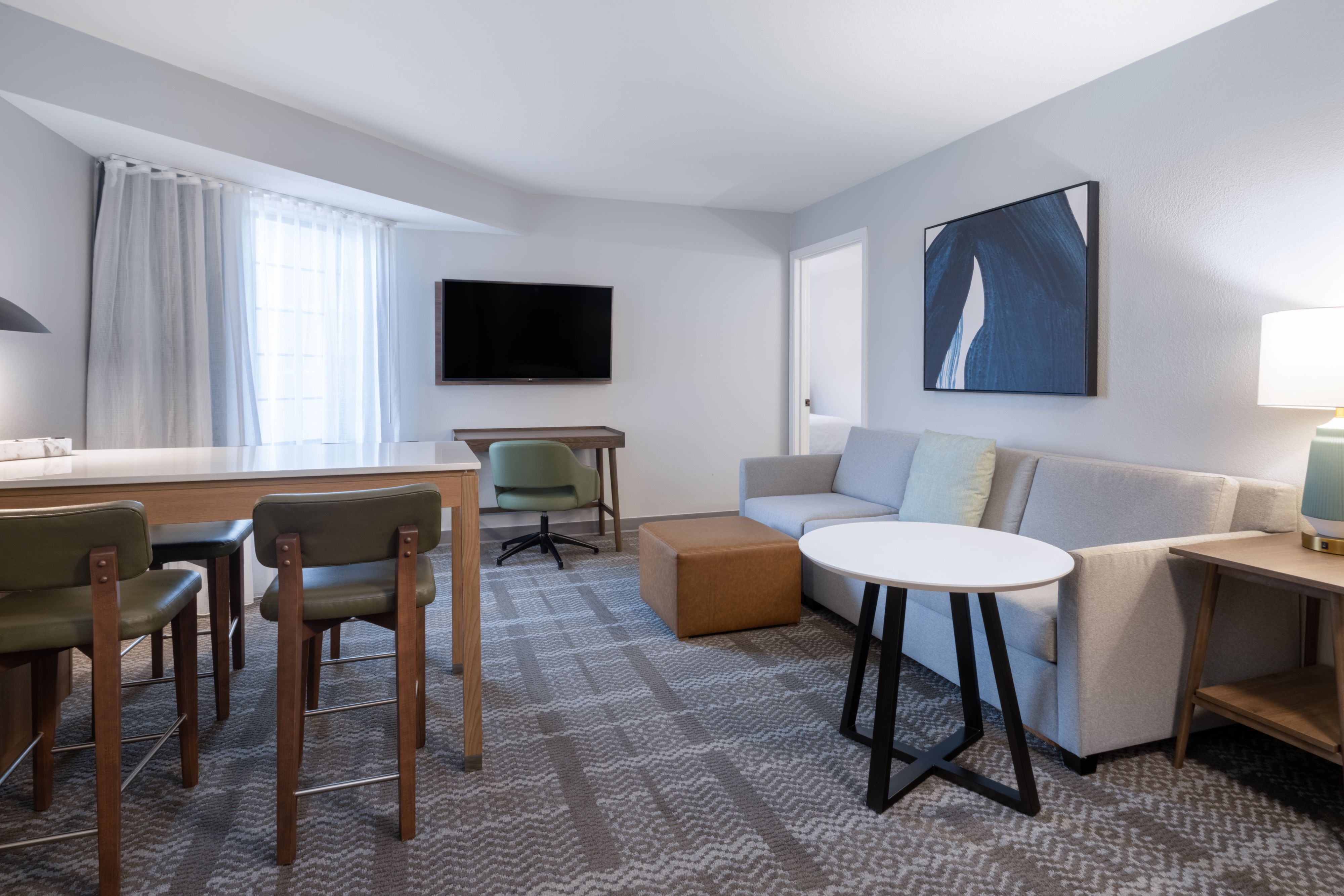 image Two-bedroom suite with full kitchen and comfortable furnishings.