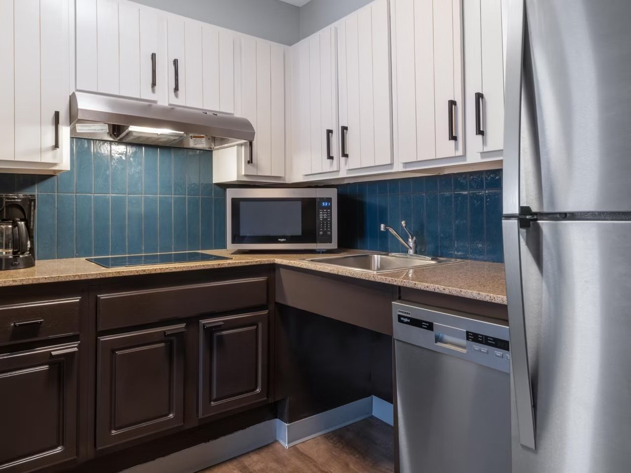 image Sleek kitchen with stainless steel appliances and granite countertops.
