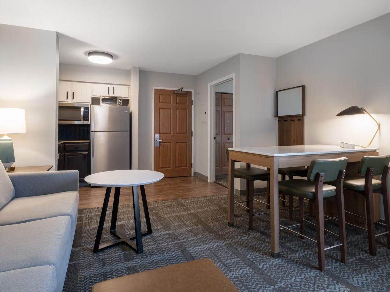 image Inviting living area with comfortable couch and dining table for shared meals.