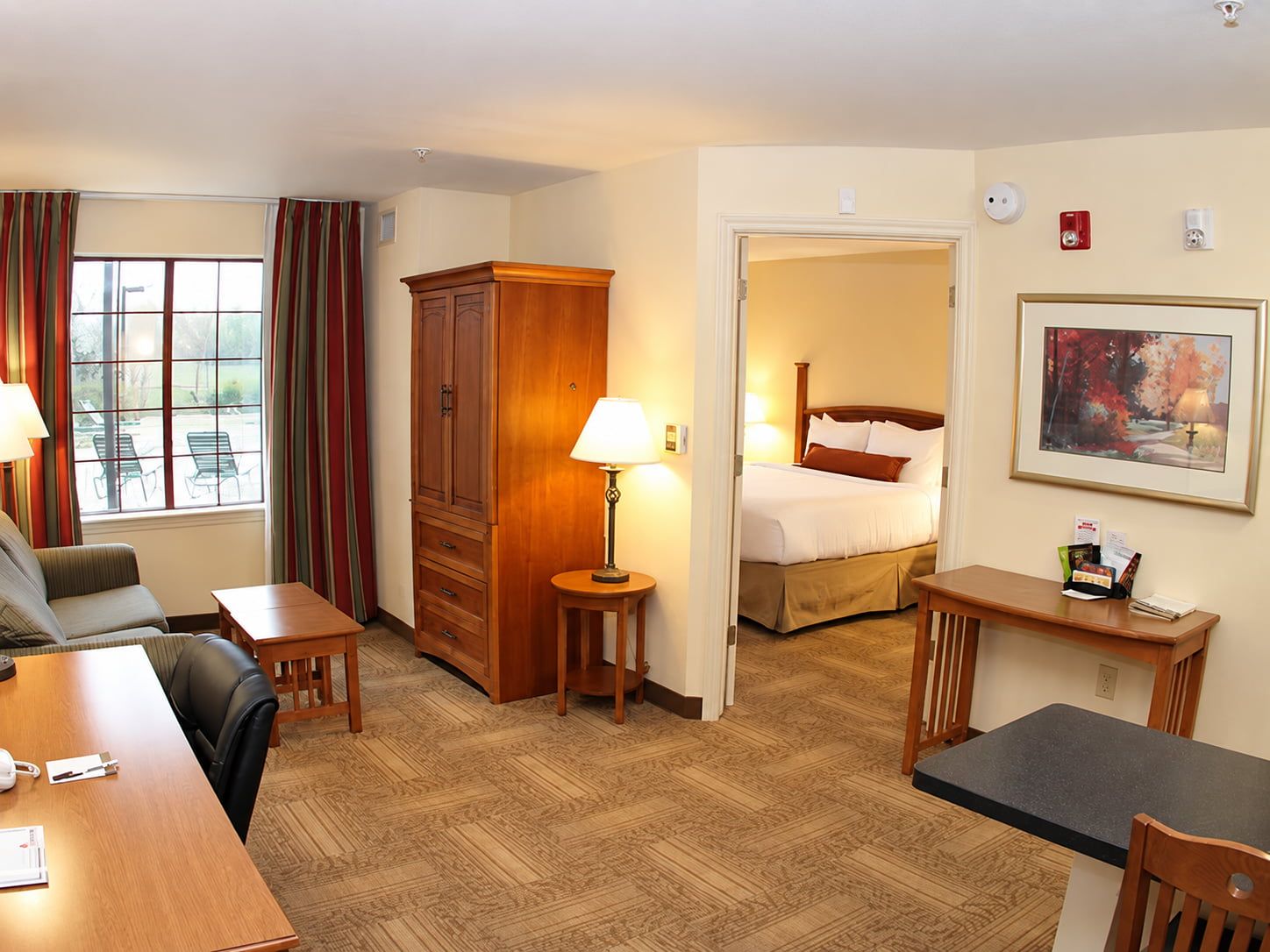 image Spacious suite with a separate bedroom and comfortable furnishings.