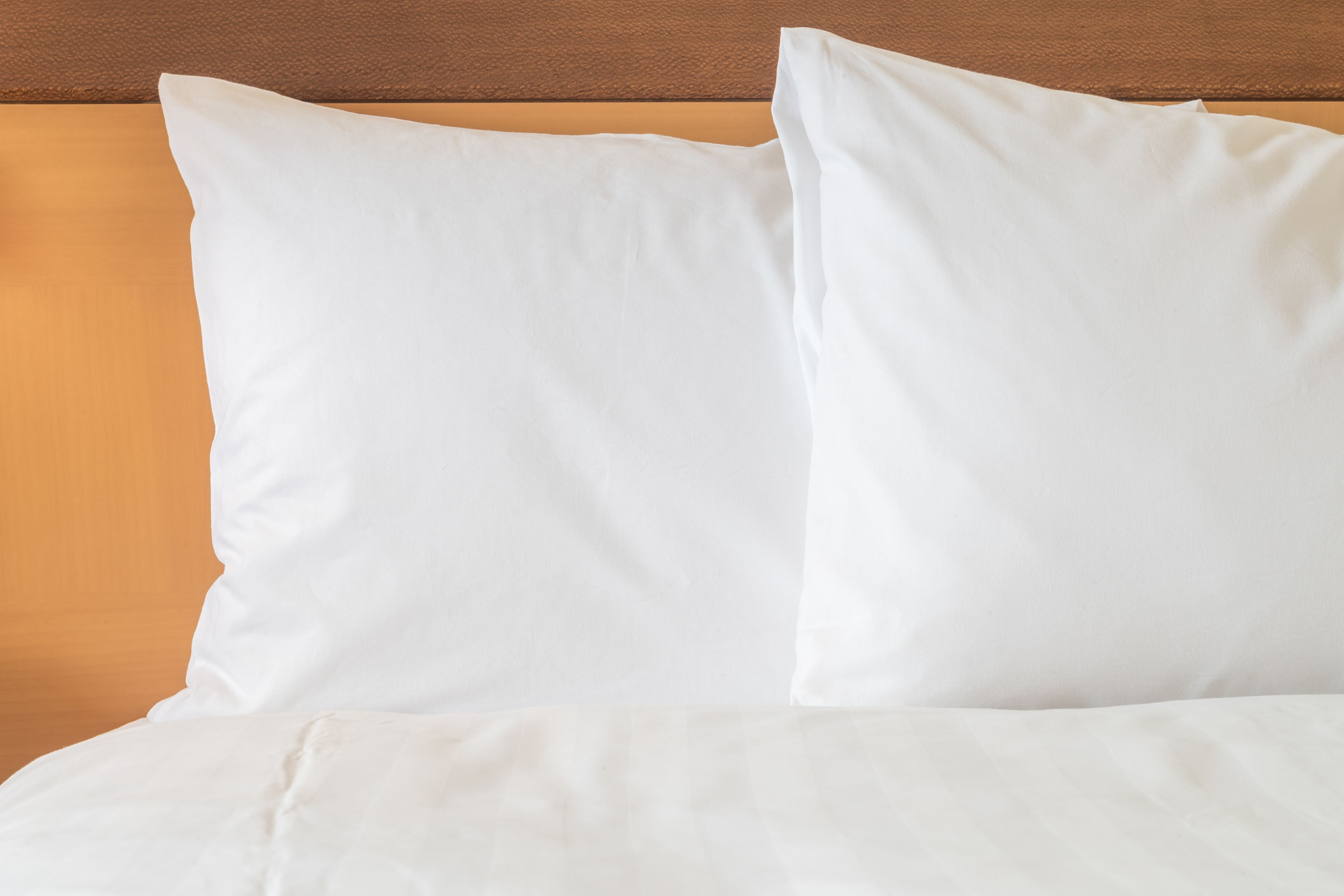 image Fluffy white pillows and premium linens for a comfortable night's sleep.