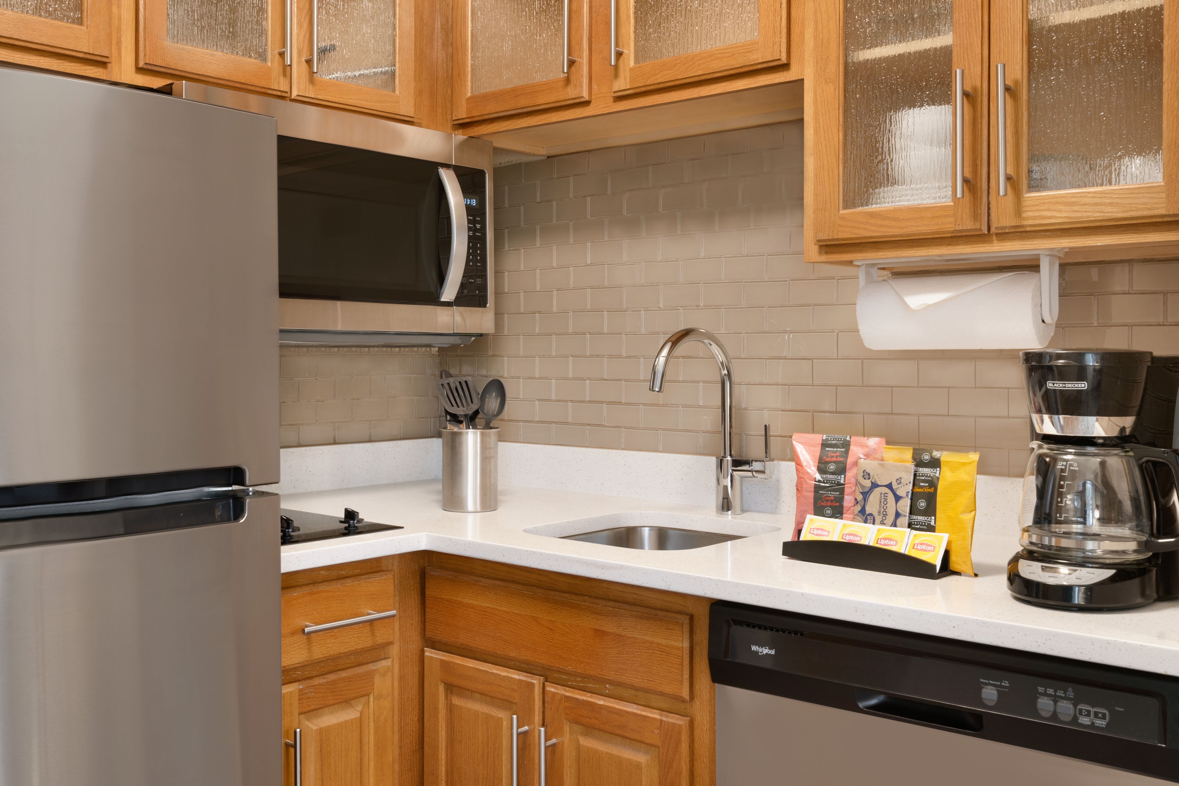 image Well-appointed kitchen with sleek appliances and dining options.