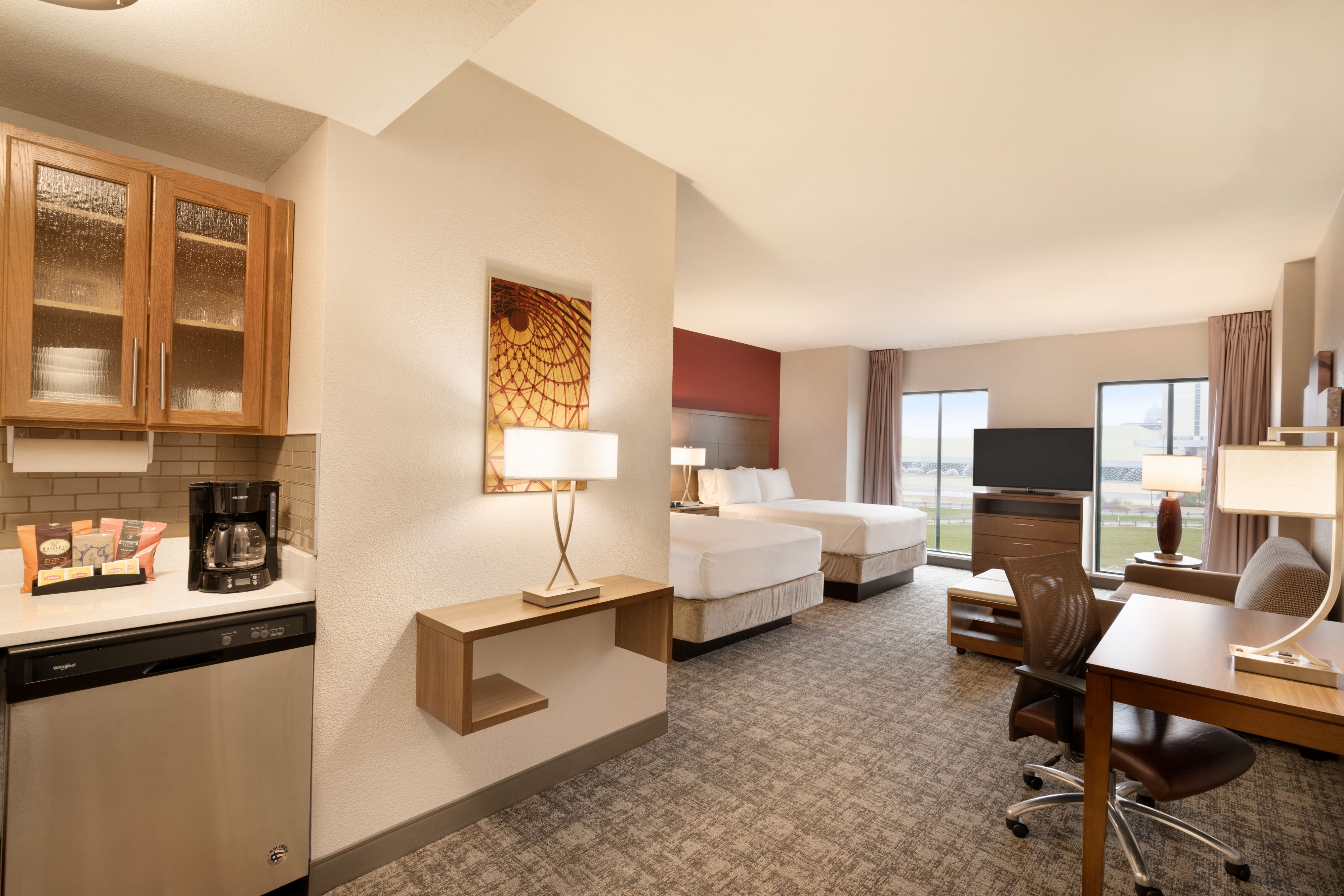 image Studio room with two queen beds and fully equipped kitchen.