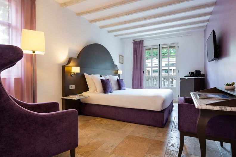 image Decorated in warm Provençal tones with terracotta floors and classic furnishings, the Classique rooms offer a comfortable and characterful base for exploring the region.