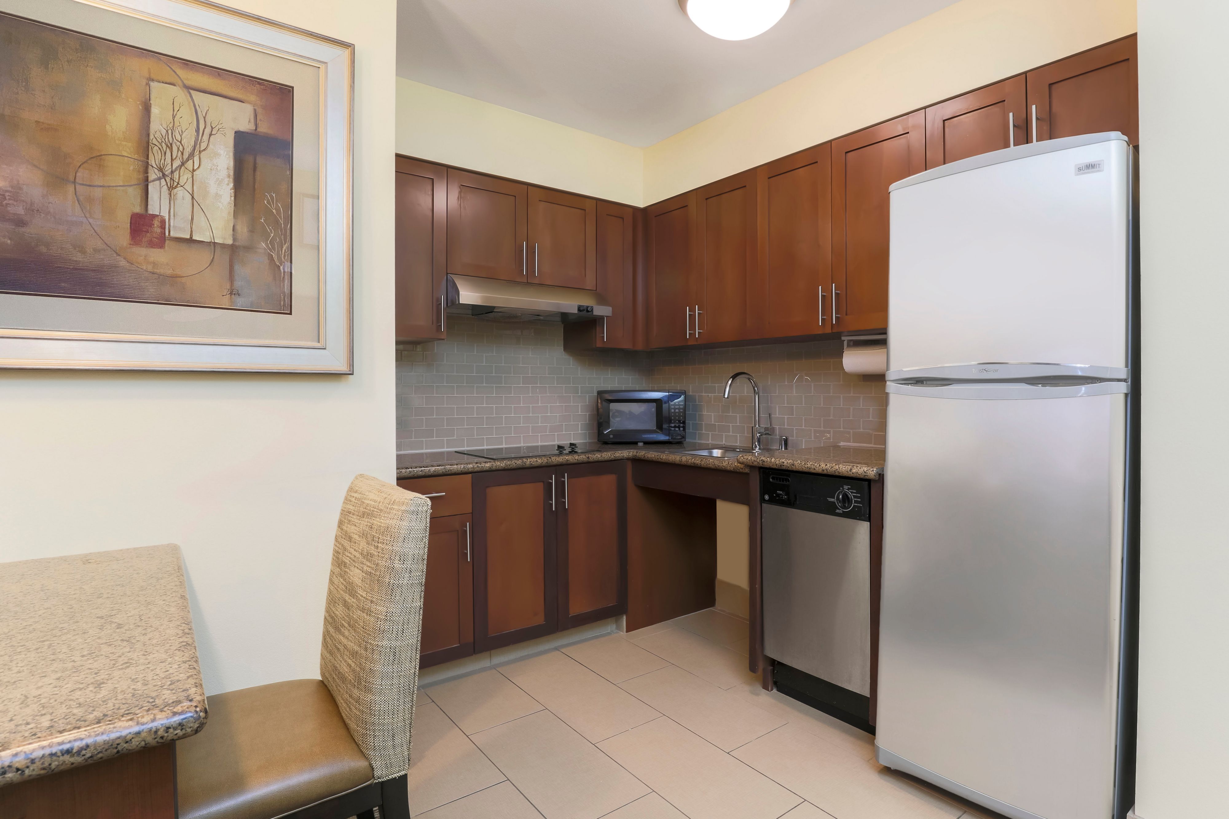 image Whip up a meal in the fully equipped kitchen, complete with a dining table.