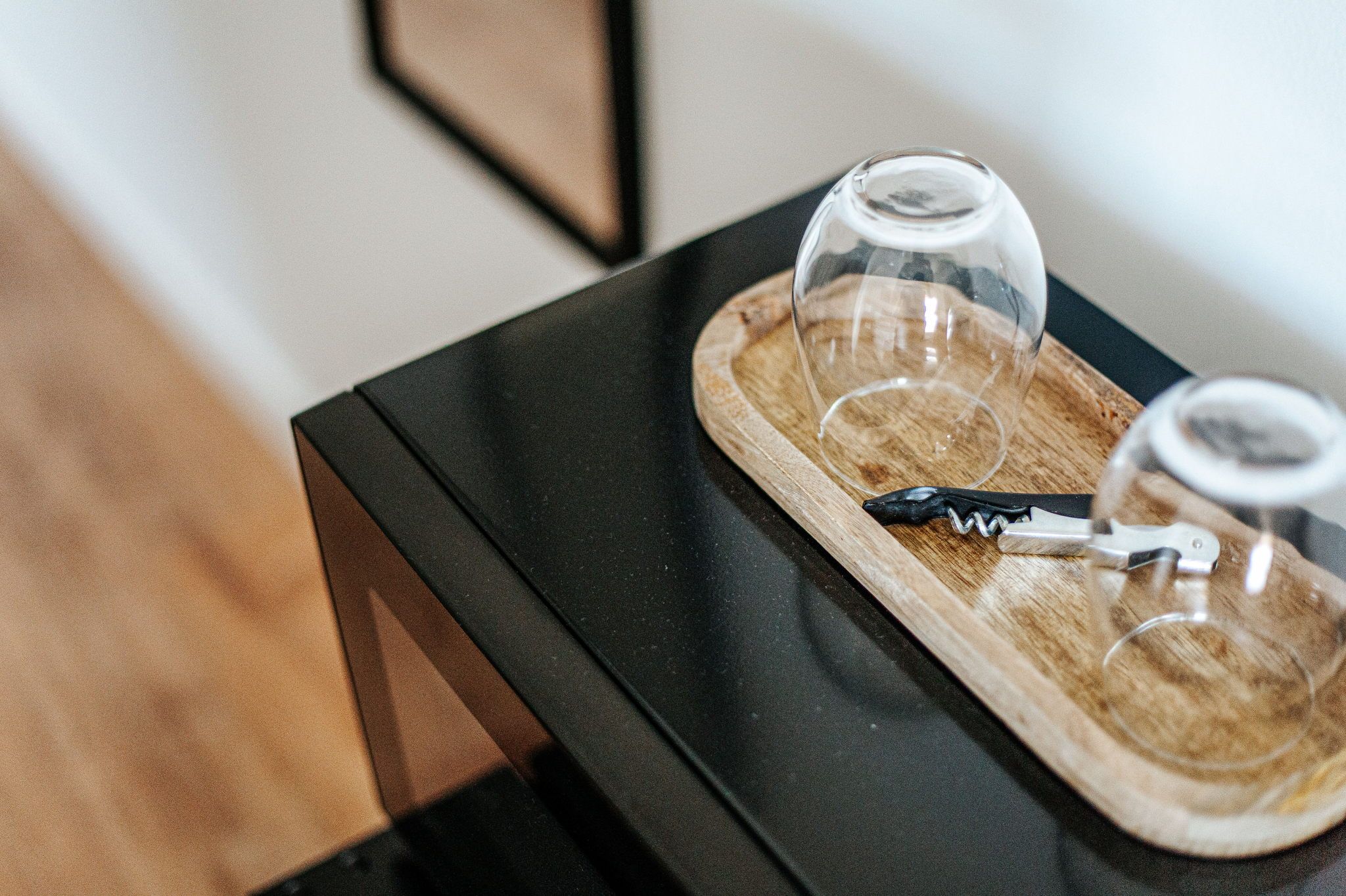 image Uncork your favorite drink with ease using this stylish corkscrew, paired with elegant wine glasses for a toast.