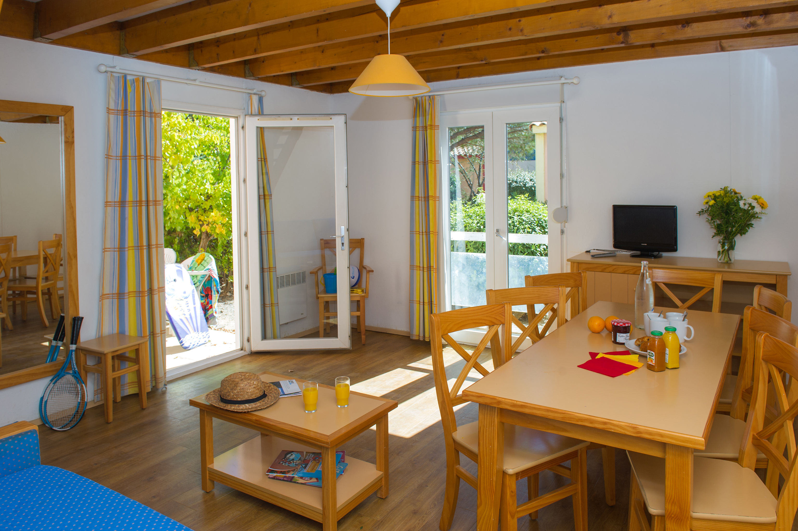 image The bright open-plan living and dining area, with direct access to the private terrace.