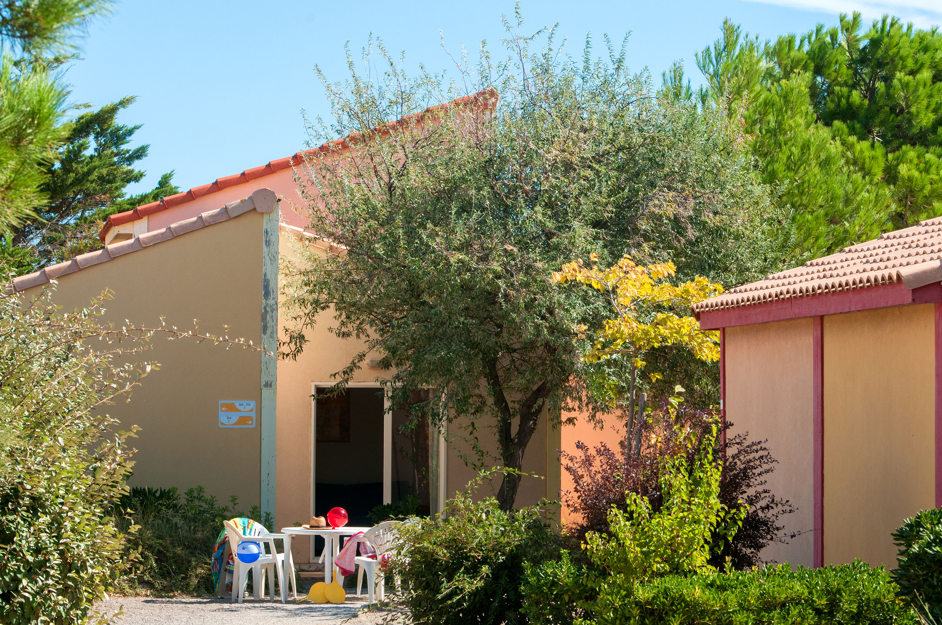 image A private terrace shaded by an olive tree, just outside your villa door.