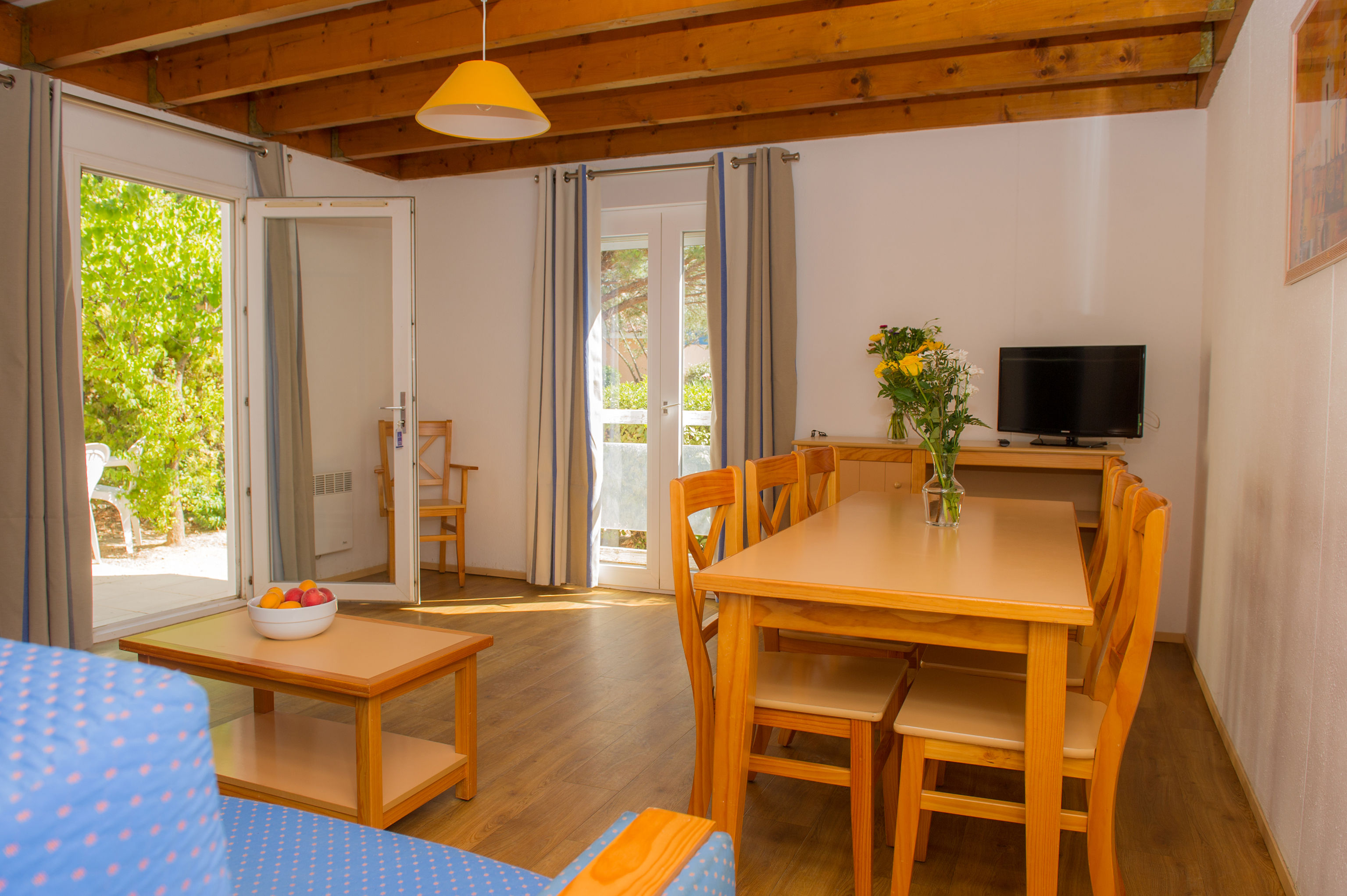 image Light floods the living space through terrace doors, creating an airy feel for up to six guests.