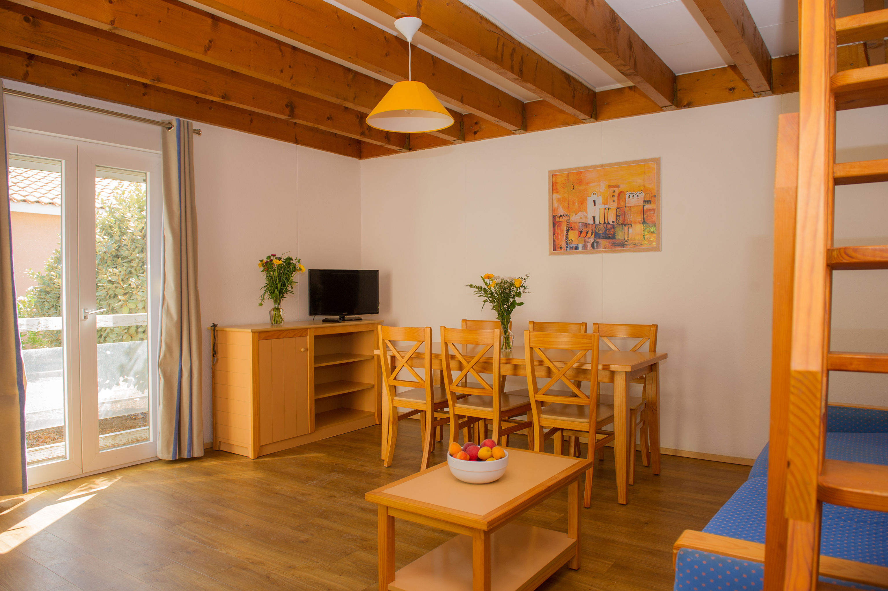 image The spacious open-plan living and dining area, with a mezzanine level and direct access to the private terrace.