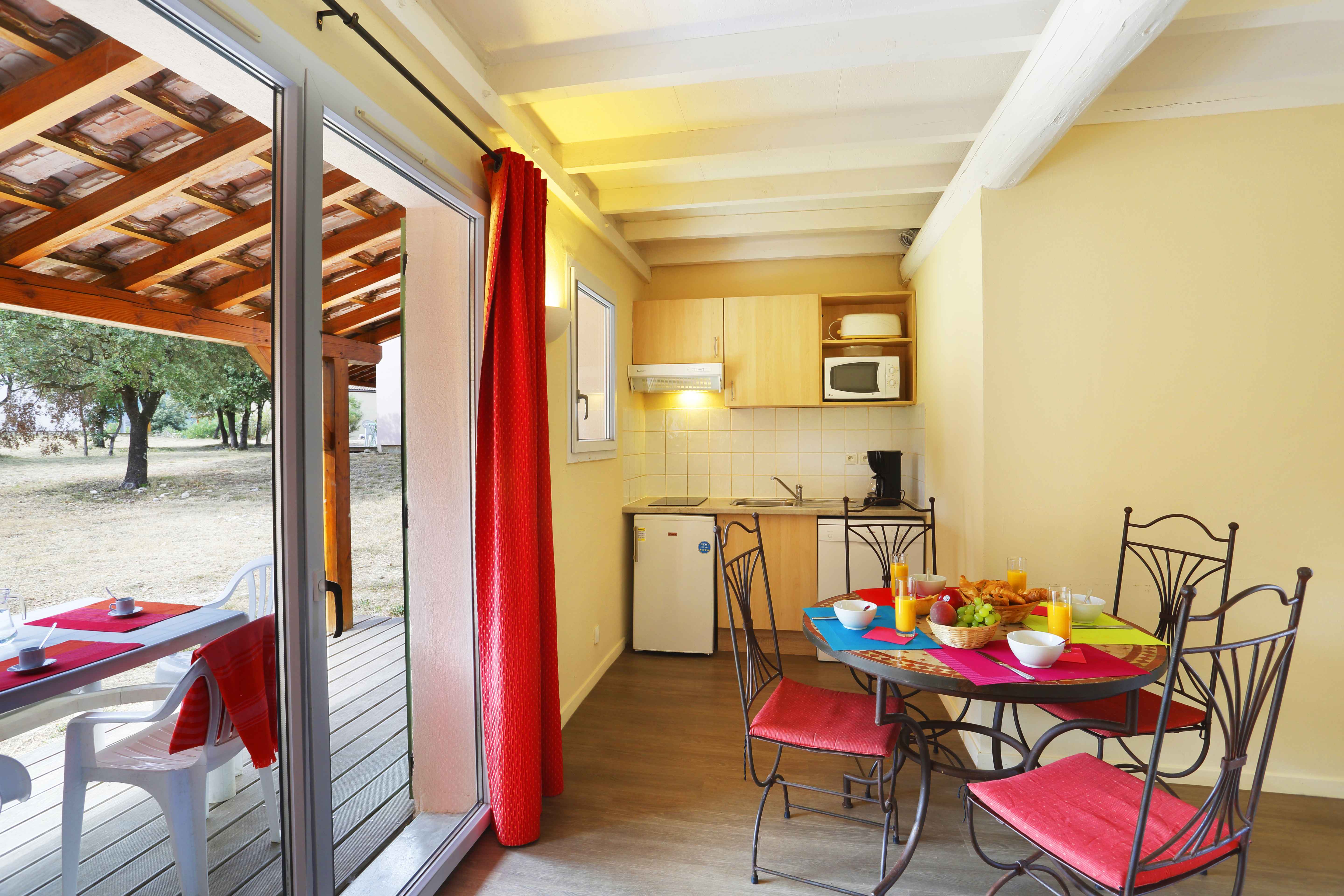 image Step straight from the kitchen onto the covered terrace — ideal for morning coffee or evening meals in the warm Languedoc air.