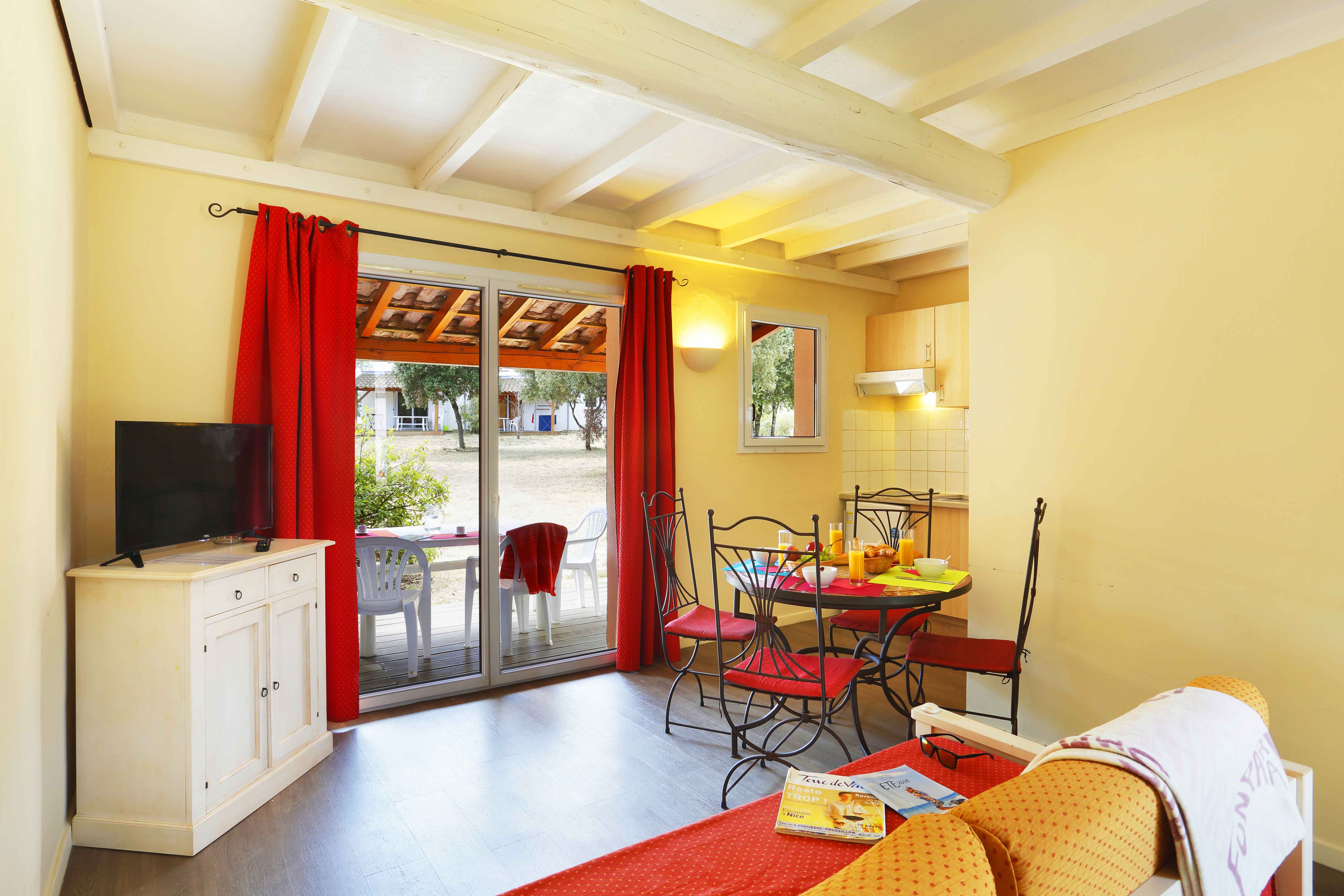 image The bright, open living space flows out to the terrace, keeping the whole group connected whether relaxing indoors or out.