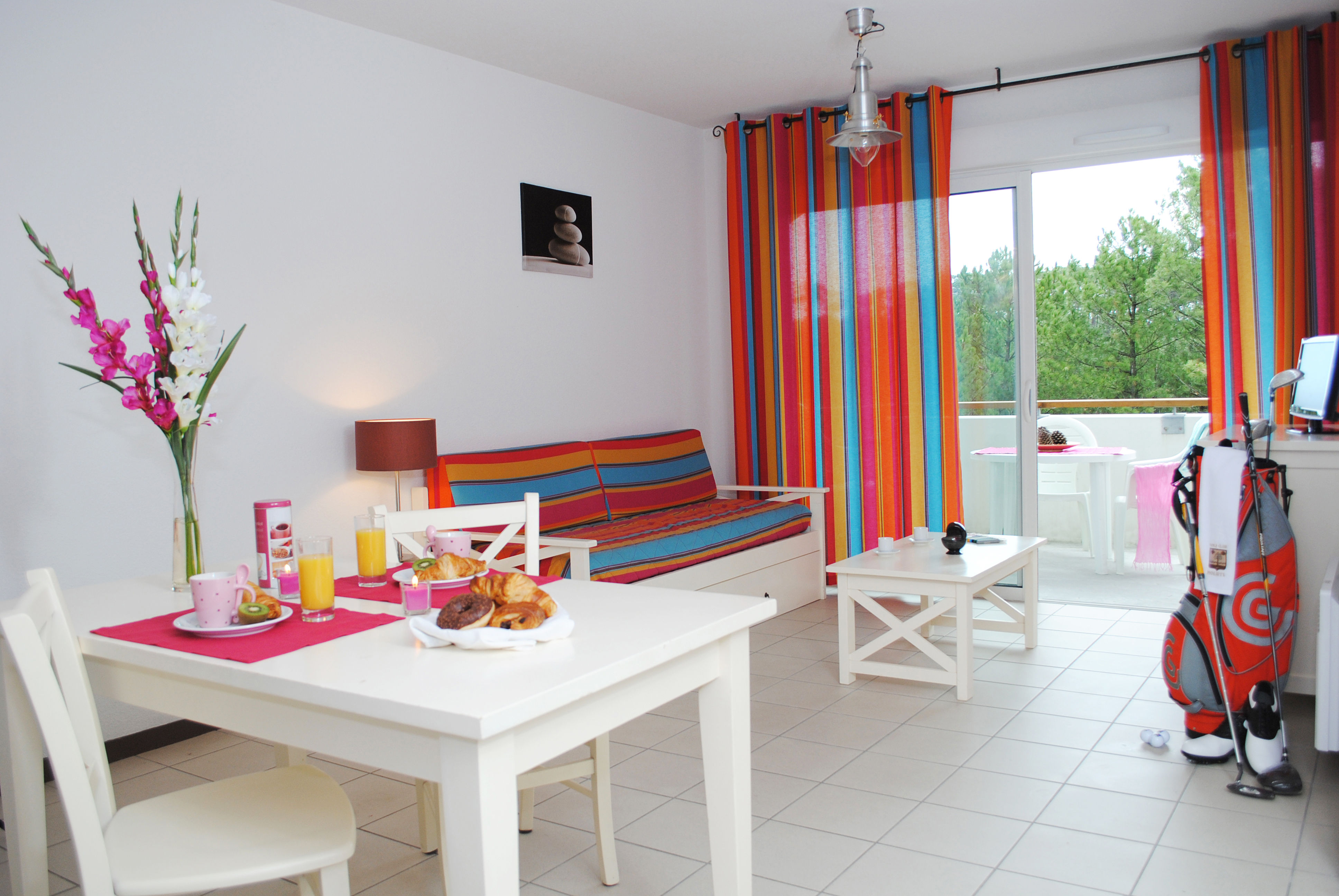 image The bright, open living and dining space is cheerfully decorated and designed for easy family living, just 600 metres from the Atlantic beach.
