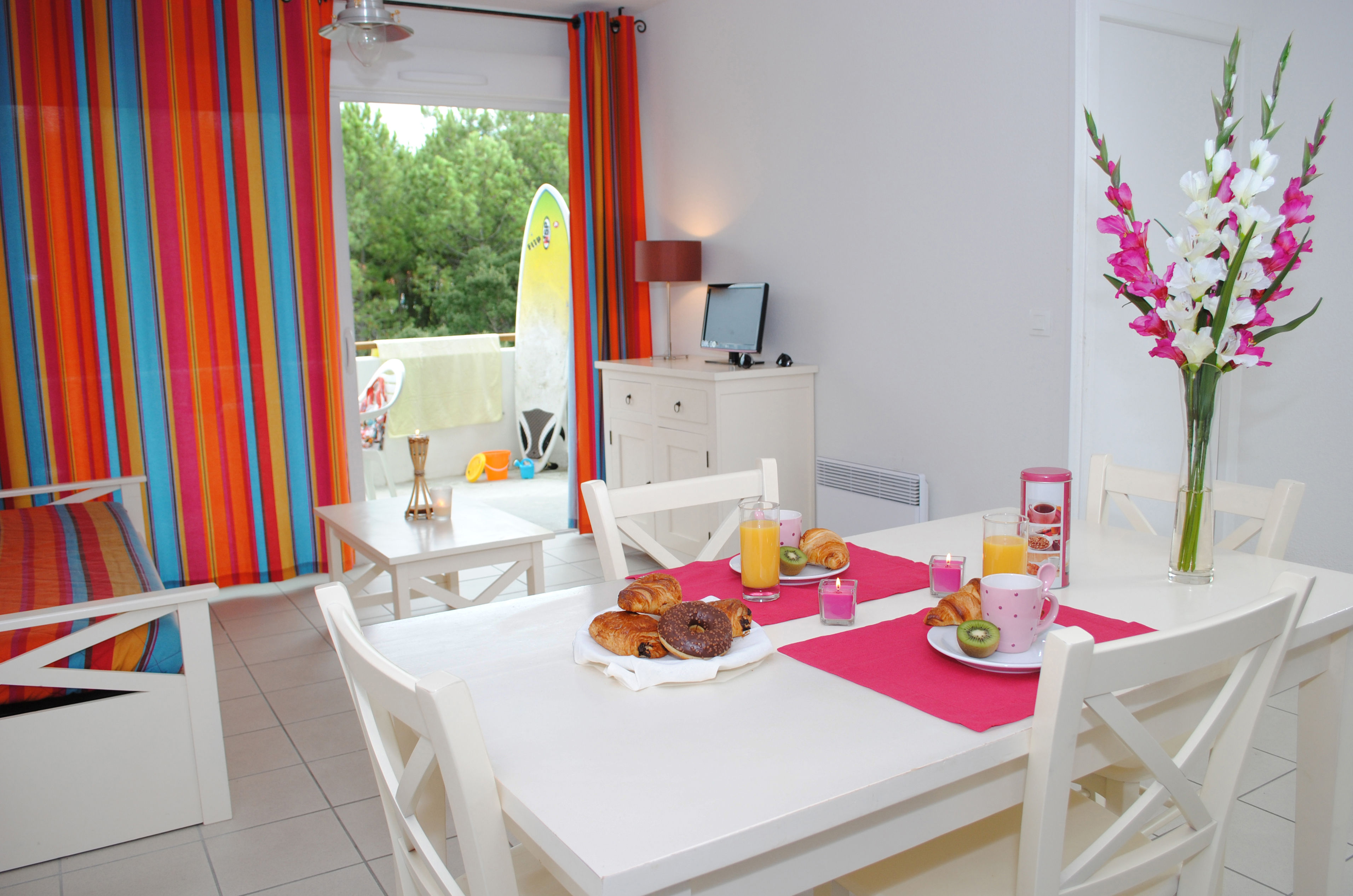 image The dining area opens onto the terrace, making it easy to enjoy meals indoors or al fresco after a day on the surf beach or the golf course.