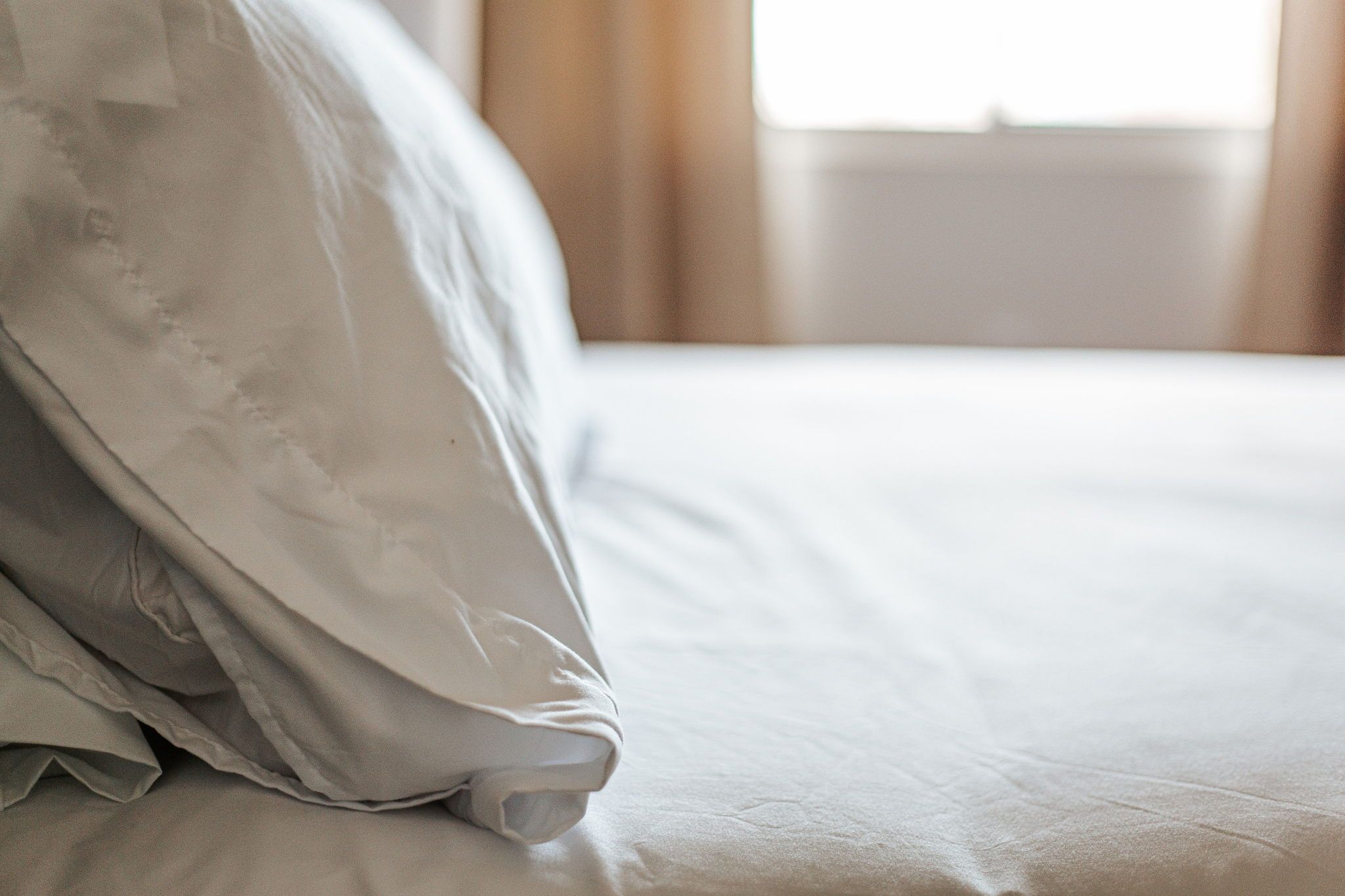 image Feel at home with freshly made beds, inviting you to unwind in comfort.