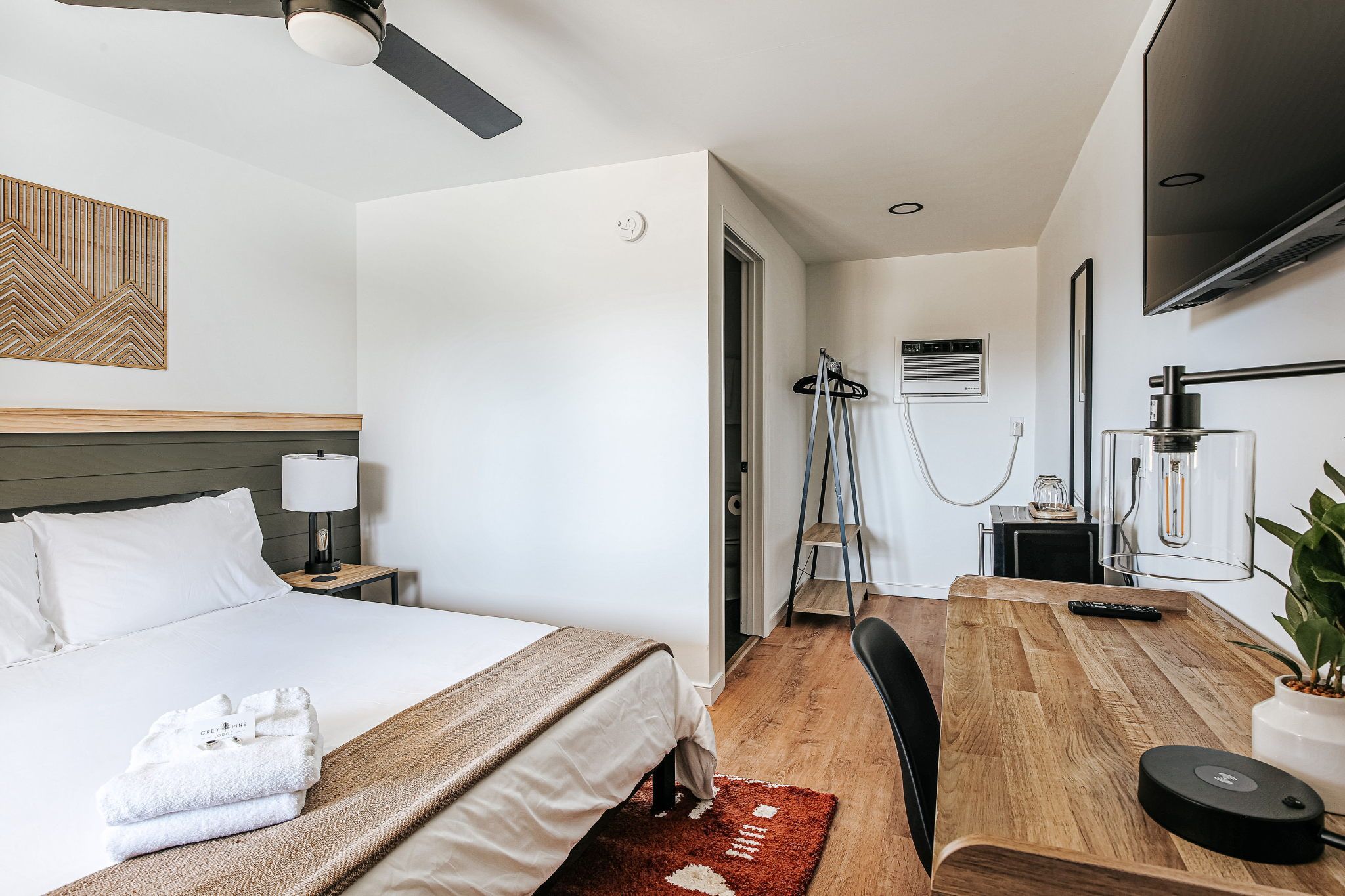image Bask in the cozy ambiance of your suite, styled with thoughtful details and a touch of warmth for a perfect retreat.