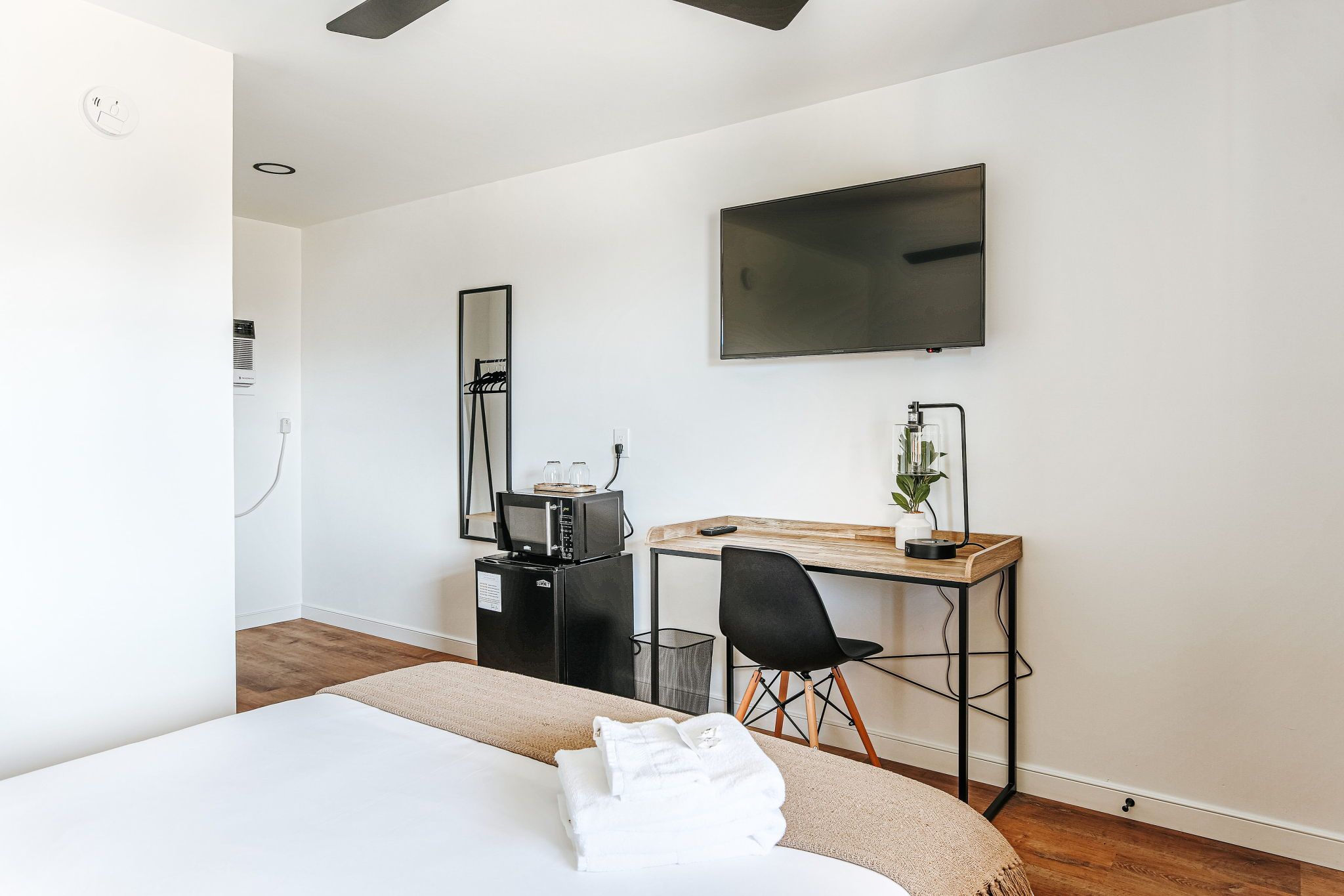 image Your inviting workspace includes a sleek desk and a mini fridge for your convenience.