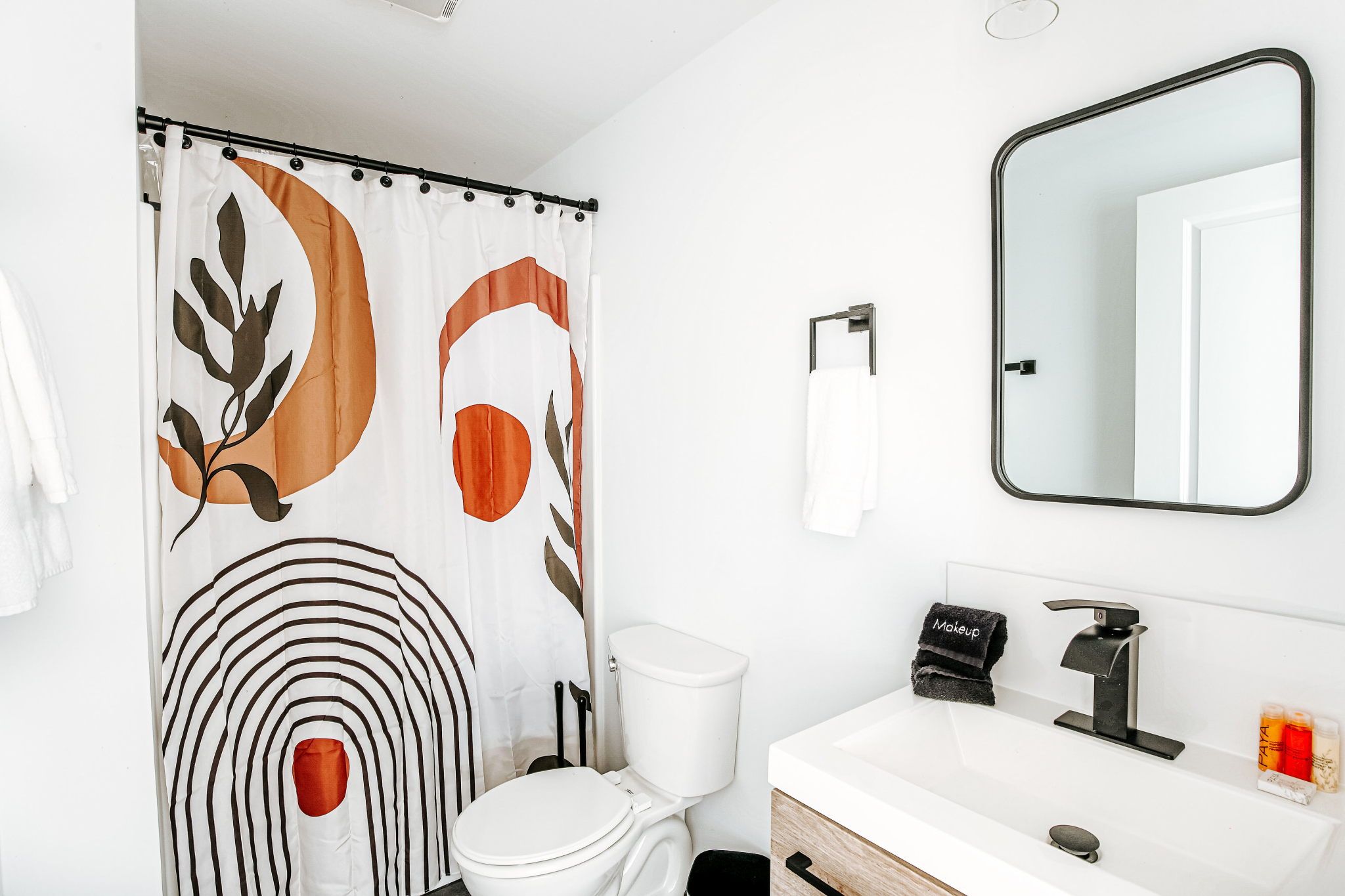 image Your comfortable retreat features a stylish workspace and cozy bed, ideal for relaxation or productivity.