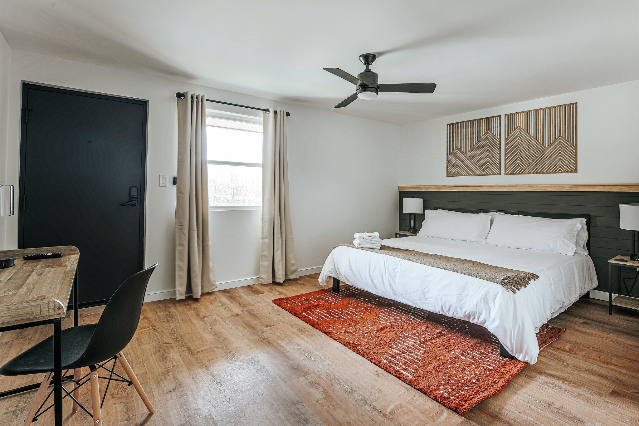 image A bright and welcoming room awaits, complete with modern furnishings and a perfect spot to work.