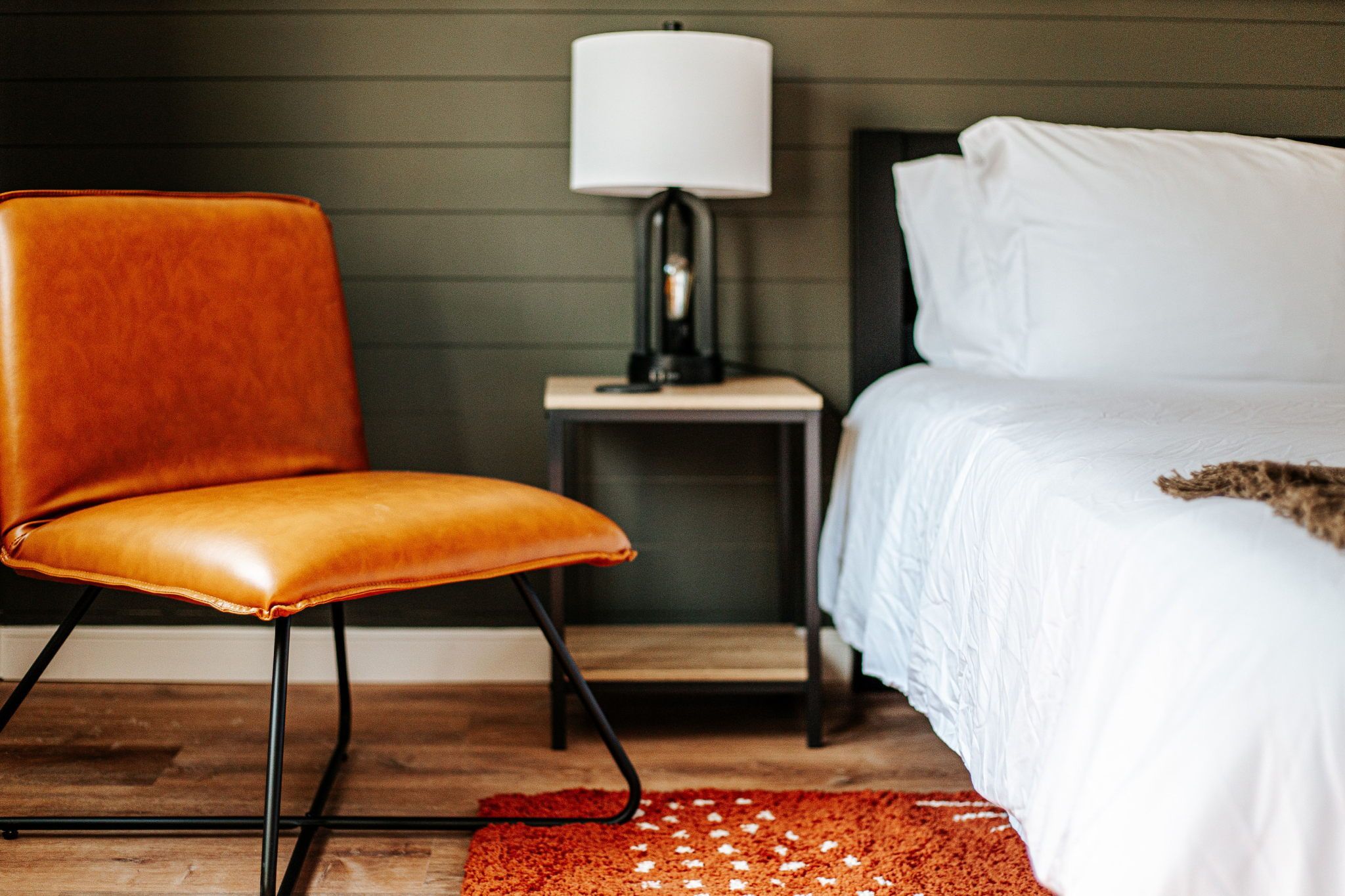 image Relax in style with a modern chair and elegant lamp, creating a serene spot for reading or unwinding.
