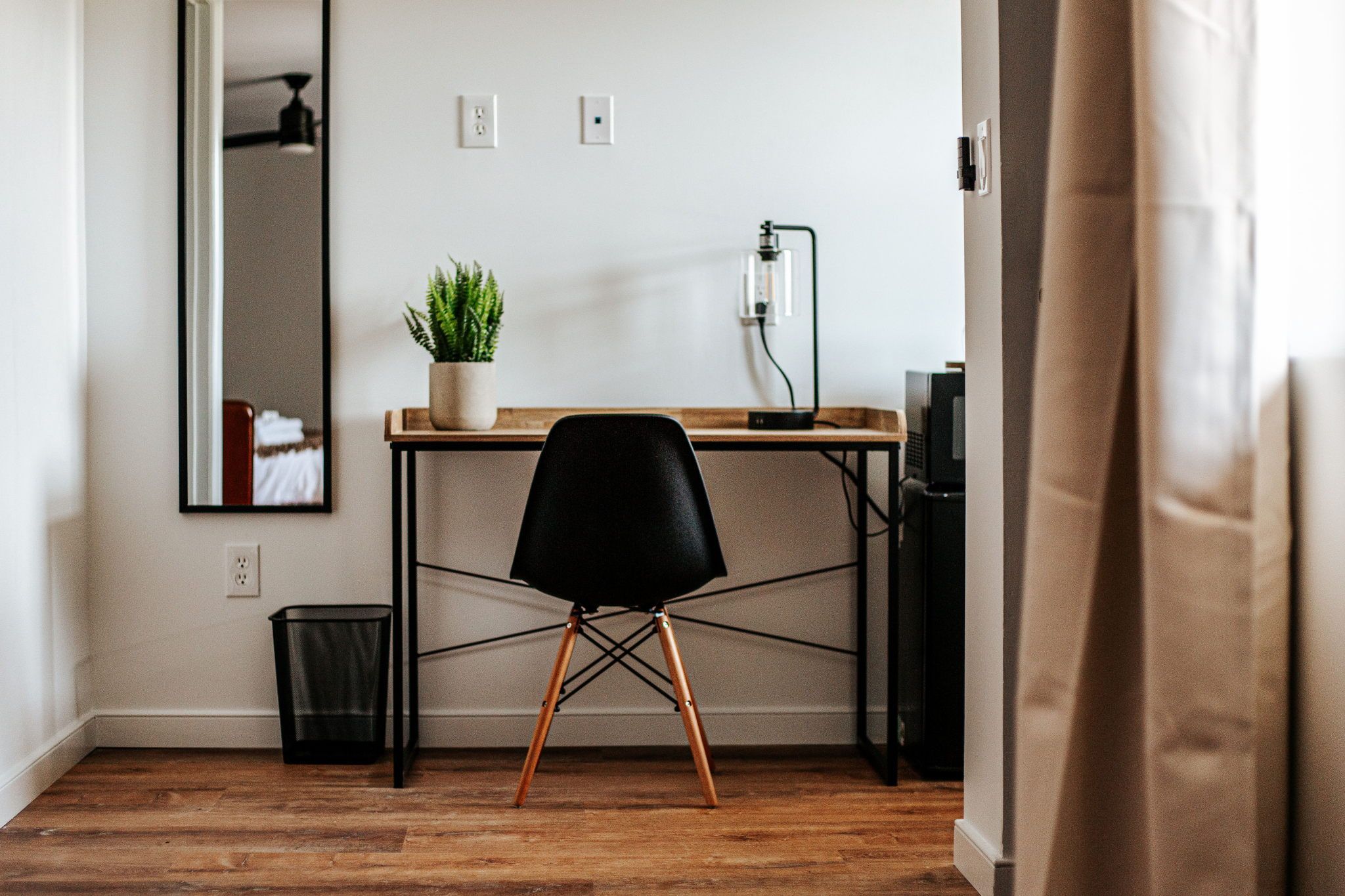 image Stay productive at your dedicated workspace, equipped with a stylish desk and cozy chair.