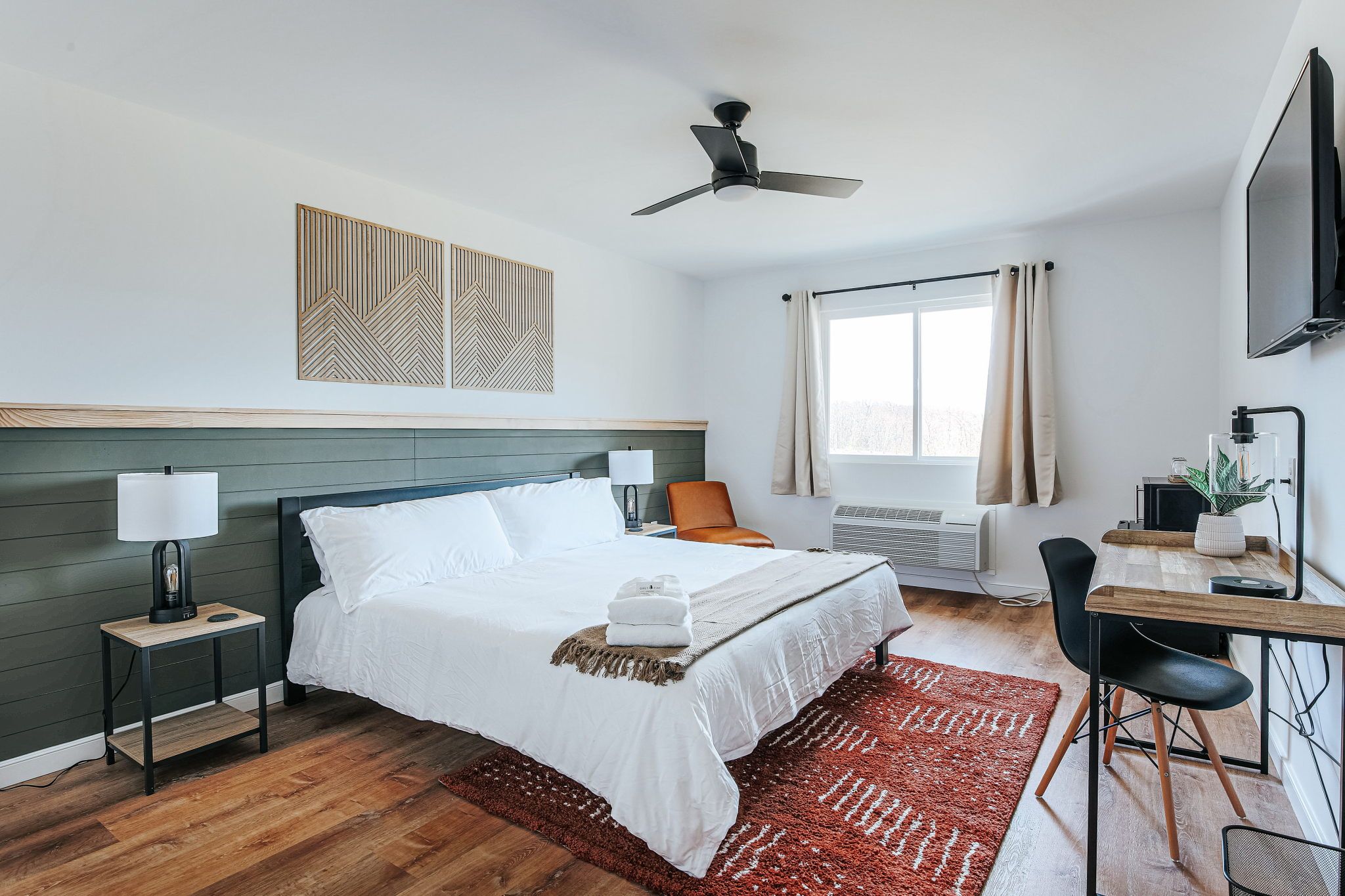 image Step into comfort with a plush king bed and charming decor, perfect for restful nights.