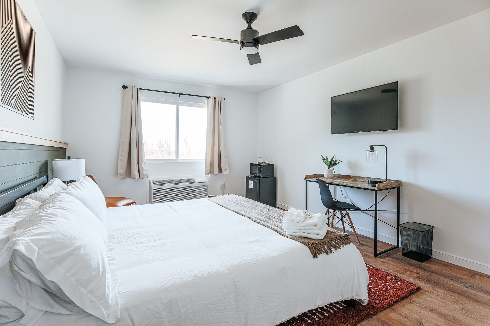 image Settle into the in-room lounge area with warm lighting, the perfect spot to unwind after a day on the trails.