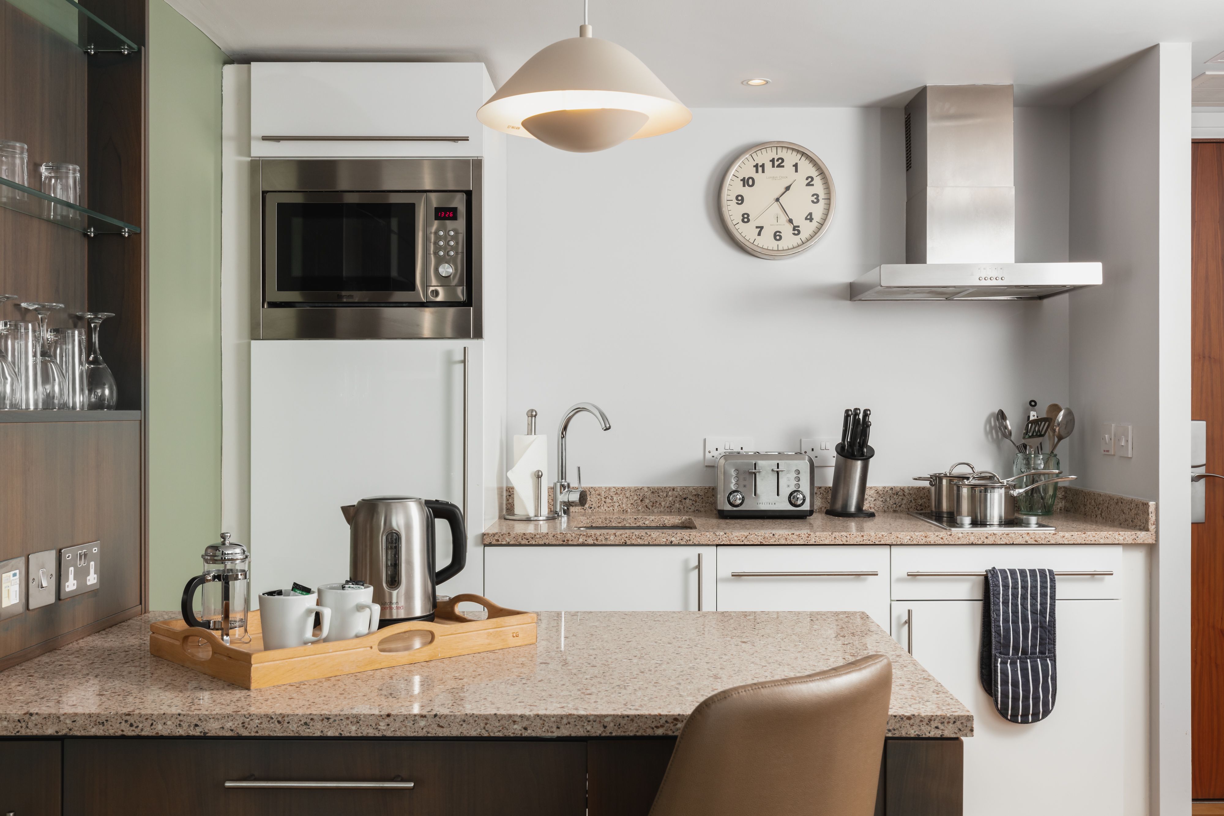 image Kitchen with modern appliances and cookware.