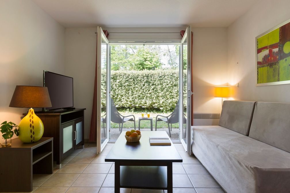 image Sliding doors open directly onto the private terrace, connecting the living space with the outdoors — ideal for evening drinks in the Gascon air.