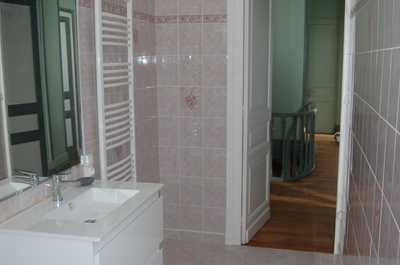 Natural light and a heated towel rail complete this bright, practical bathroom serving the estate's family suite.